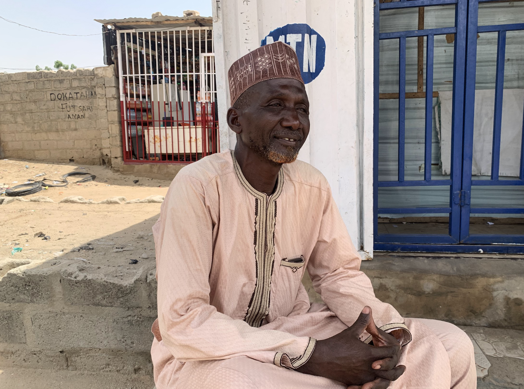 Babangida spends his days inside a shop and evenings settling disputes