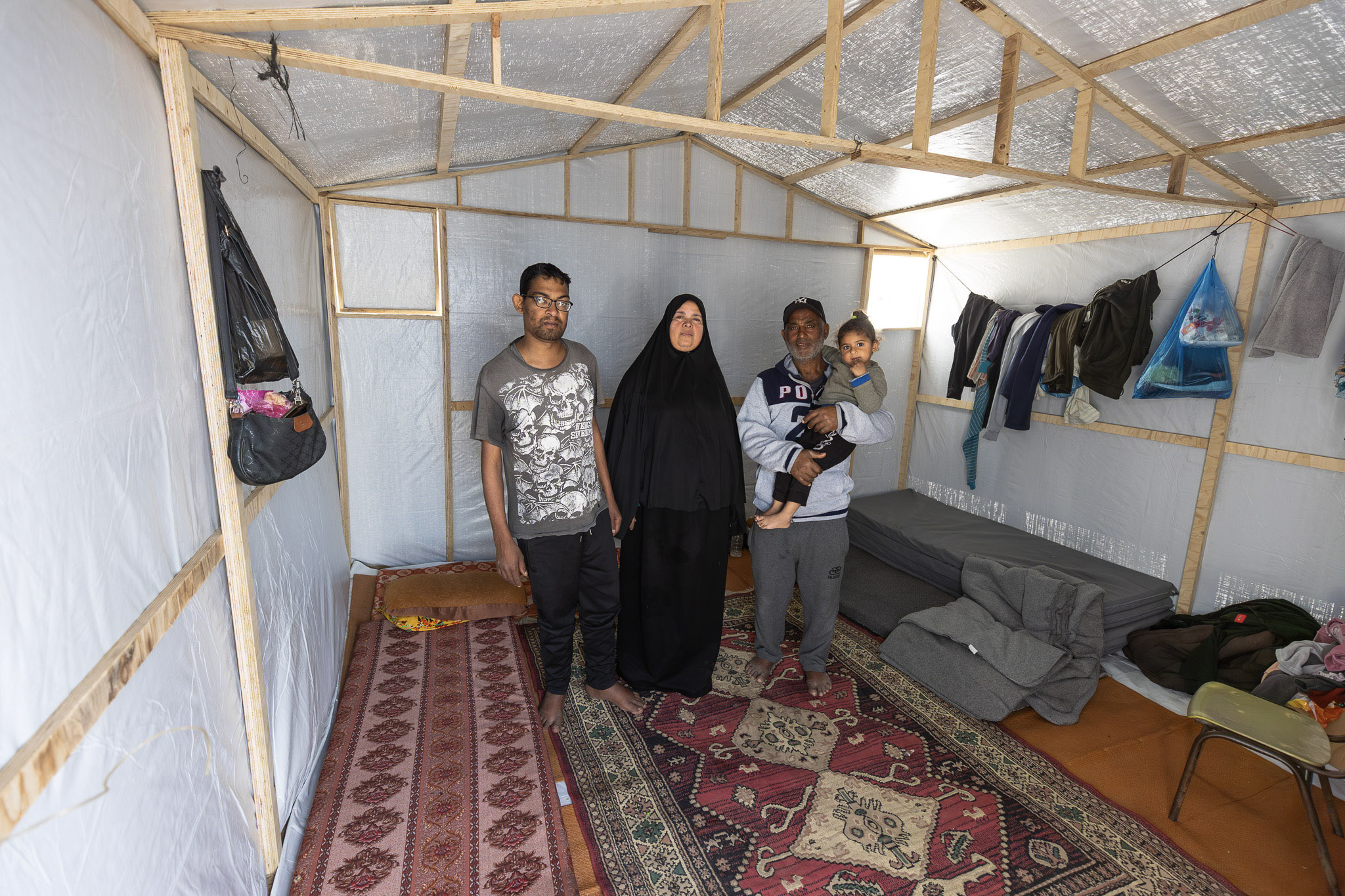 “The first and last chapter of the pain we have lived through in this war is the loss of our home. A person can only truly feel comfort and peace in their home,” says Ahmed Qwaider. A farmer from Bani Suheila, east of Khan Younis, Ahmed was displaced with his family to the western part of the city, losing both his home and his livelihood. Today, the family live in an emergency shelter that offers some kind of stability and dignity after immense loss.