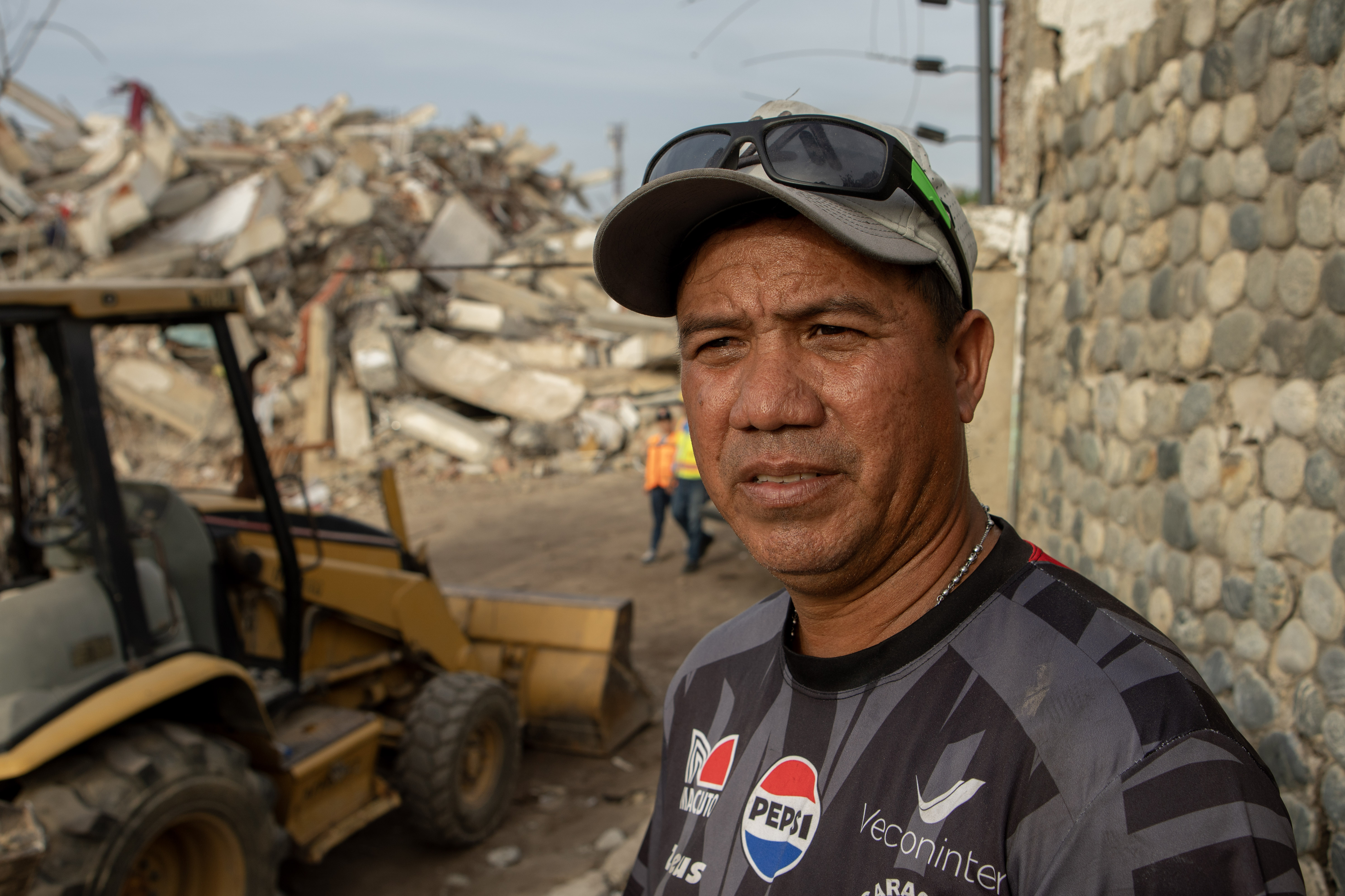 Jose Garcia stands in front of the Ritasol Palace apartment complex