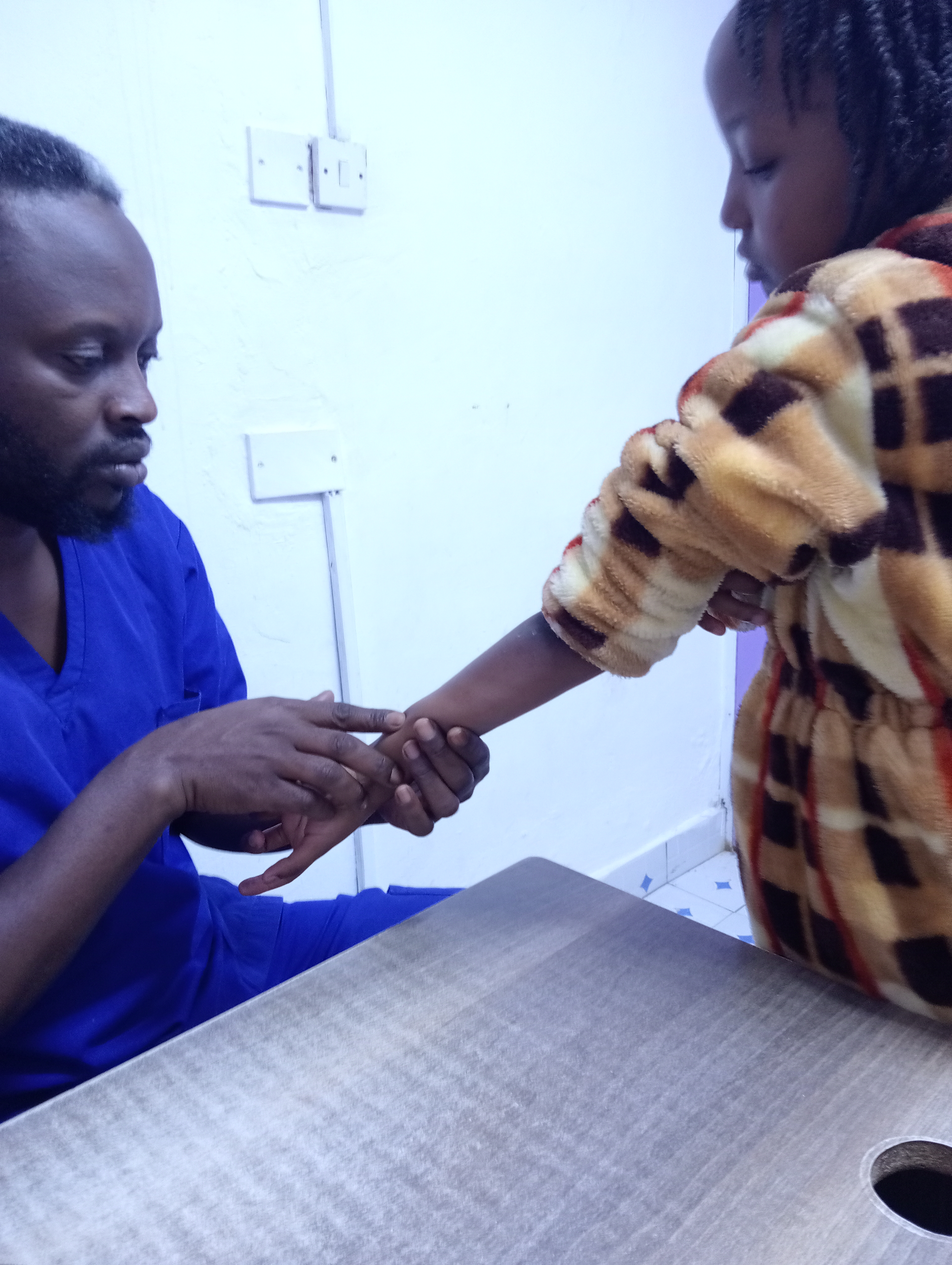 A doctor prepares to vaccinate a 10-year-old girl in Garissa, northeastern Kenya [Gitonga Njeru]