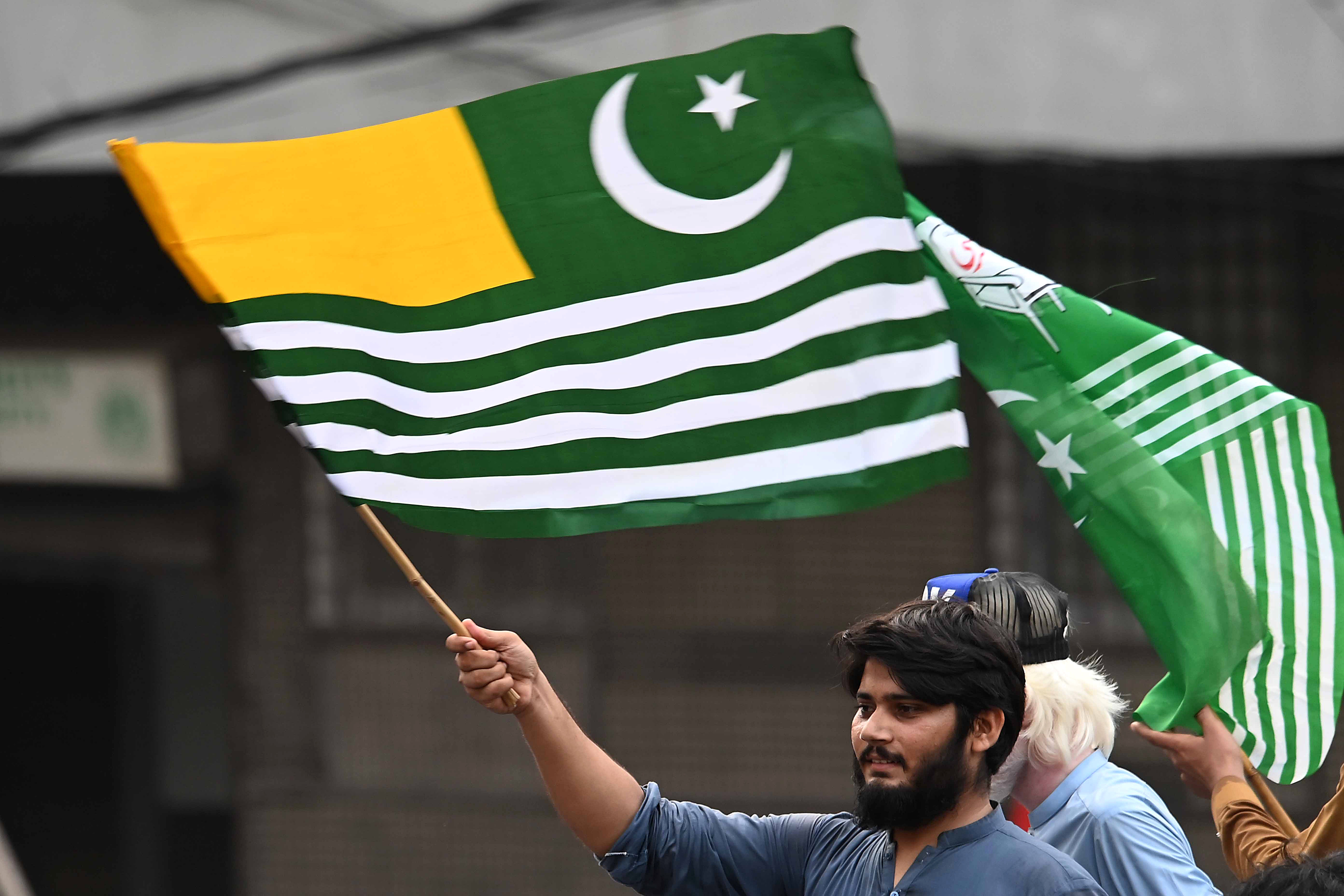 A man waves a flag