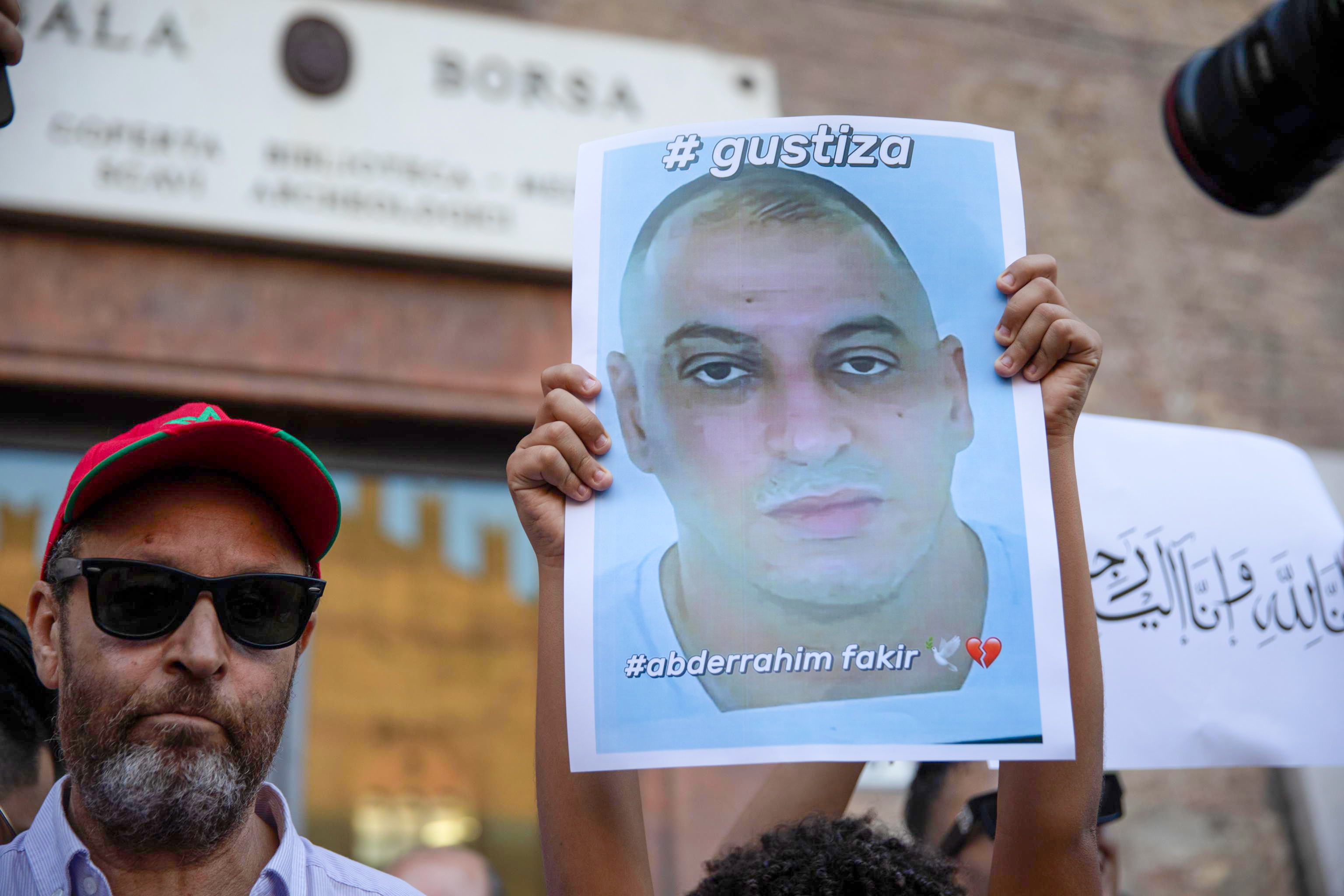 epa13123809 People hold a picture during a demonstration calling for justice for Abderrahim Fakir, a Moroccan man who died while being restrained by police during an arrest, in Bologna, Italy, 20 July 2026. EPA/MAX CAVALLARI