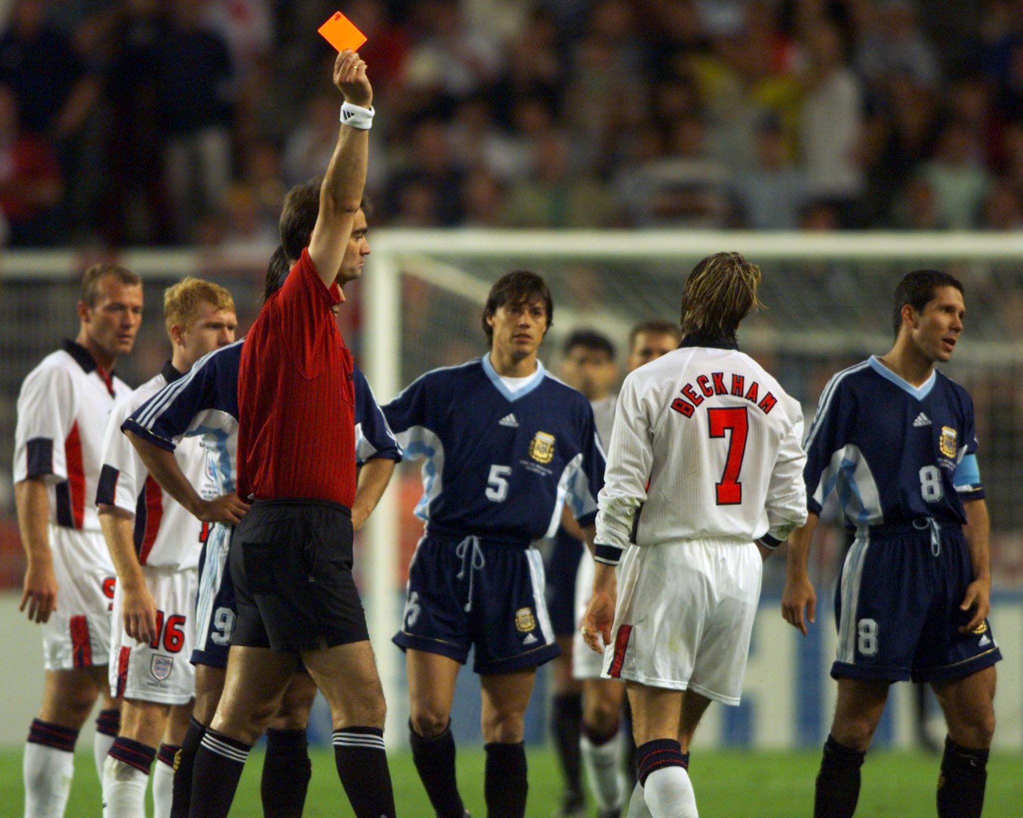 Danish referee Kim Milton Nielsen (L) sends off England's David Beckham (7) during their match against Argentina in St Etienne June 30.