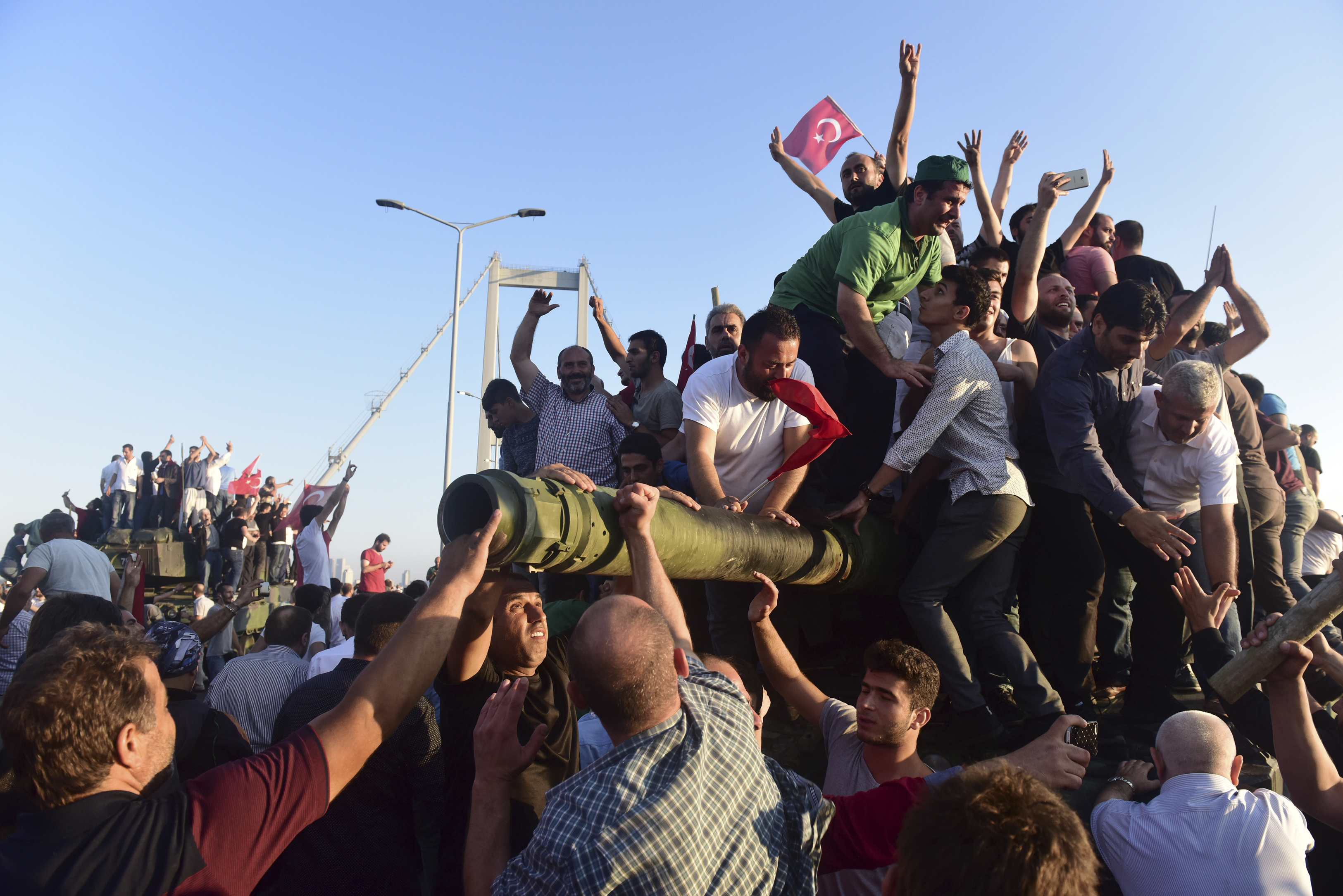 Supporters of Turkish President Tayyip Erdogan celebrate after soldiers involved in the coup surrendered