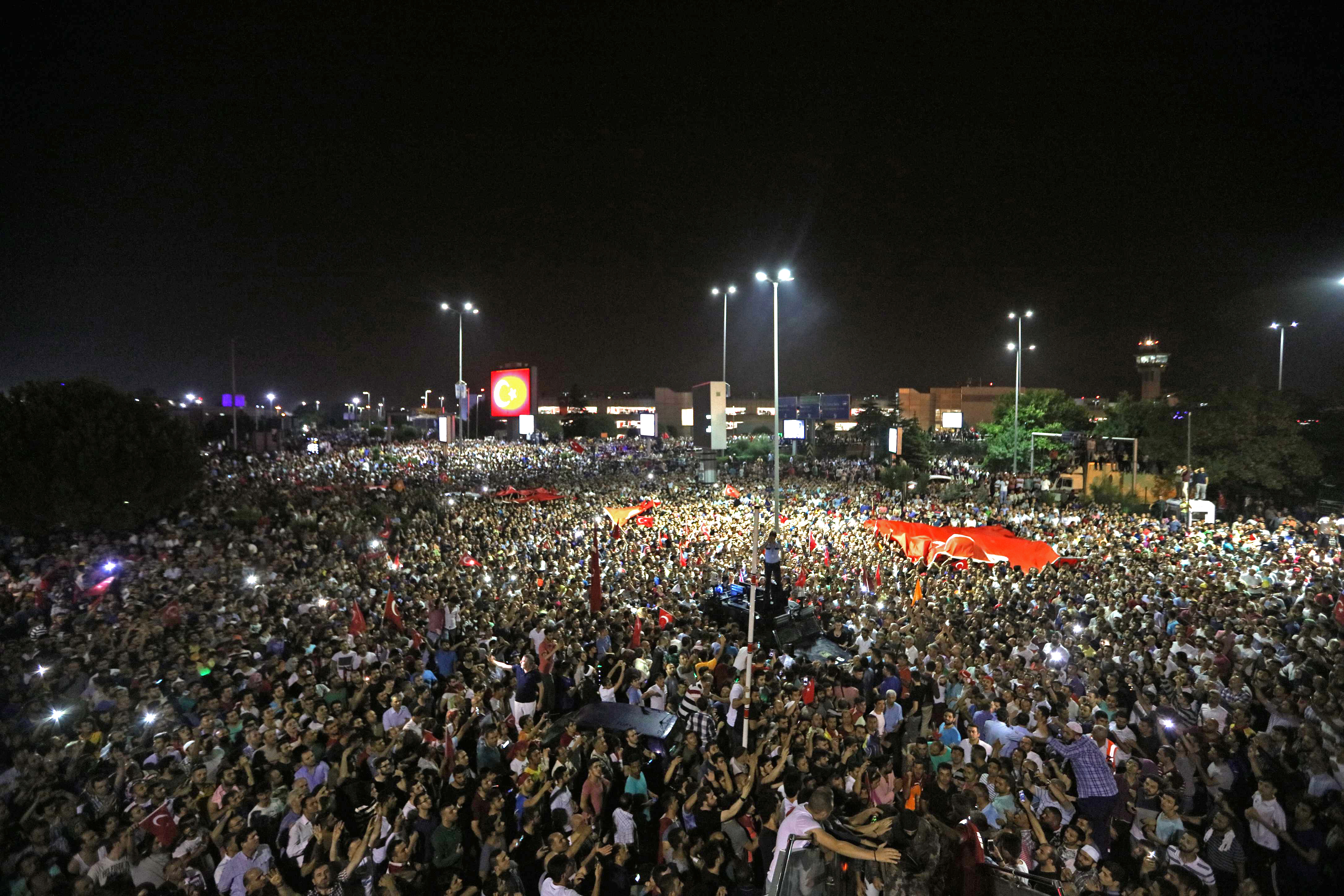 People demonstrate outside Ataturk international airport during an attempted coup in Istanbul