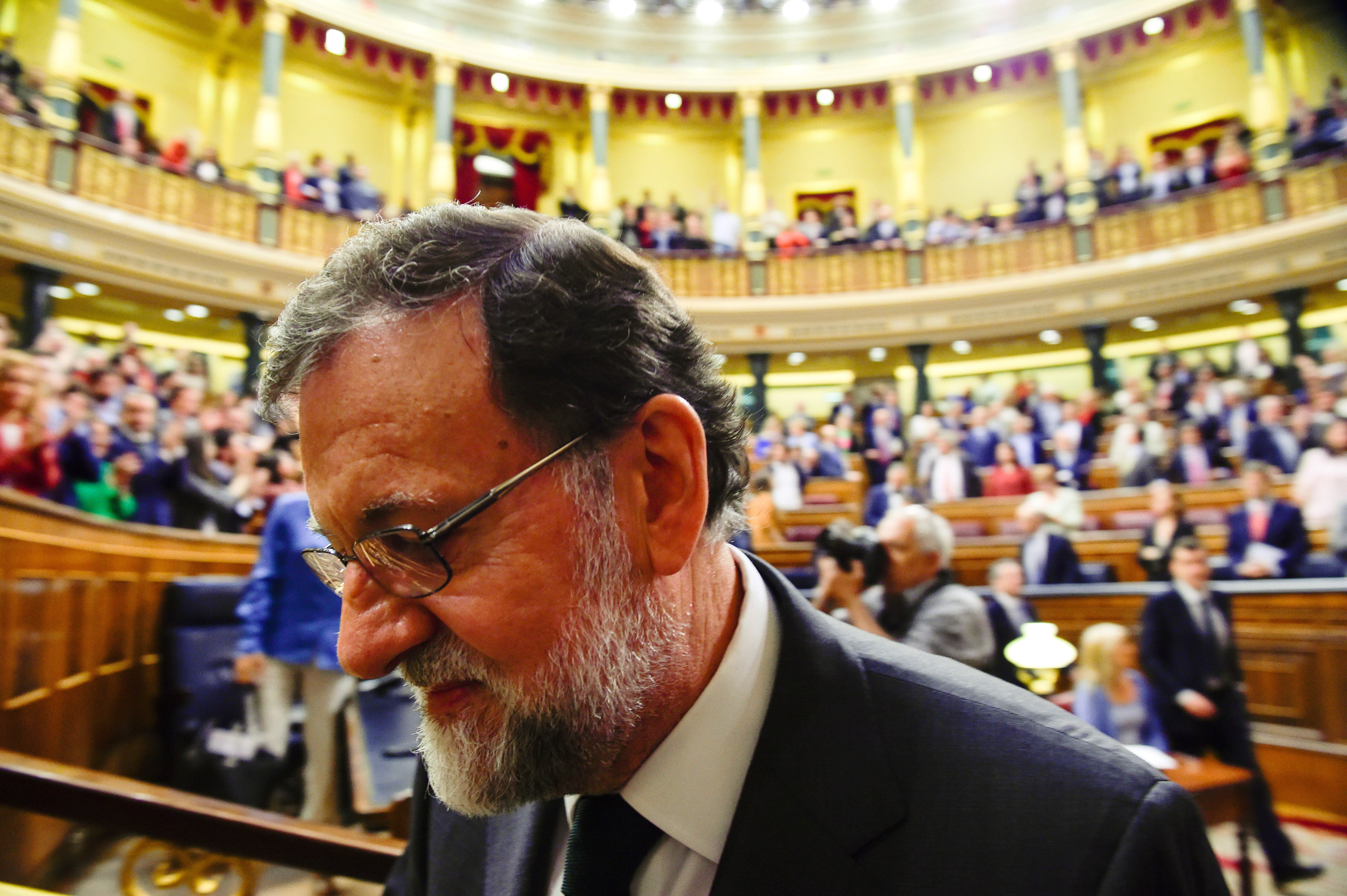Spain's ousted Prime Minister Mariano Rajoy leaves the chamber after a motion of no confidence vote at parliament in Madrid, Spain, June 1, 2018