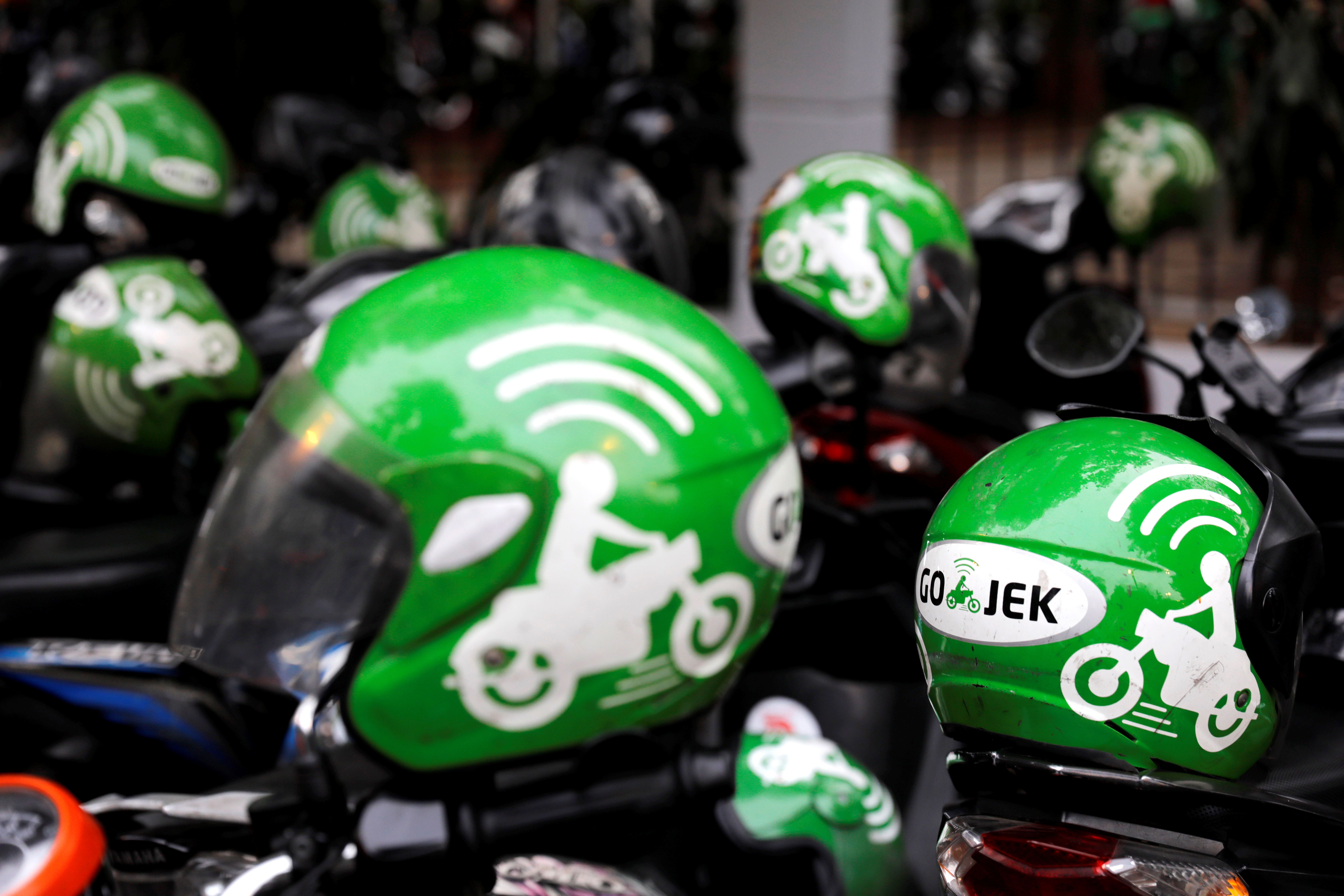 Drivers wear Gojek helmets during the Go-Food festival in Jakarta, Indonesia, on October 27, 2018