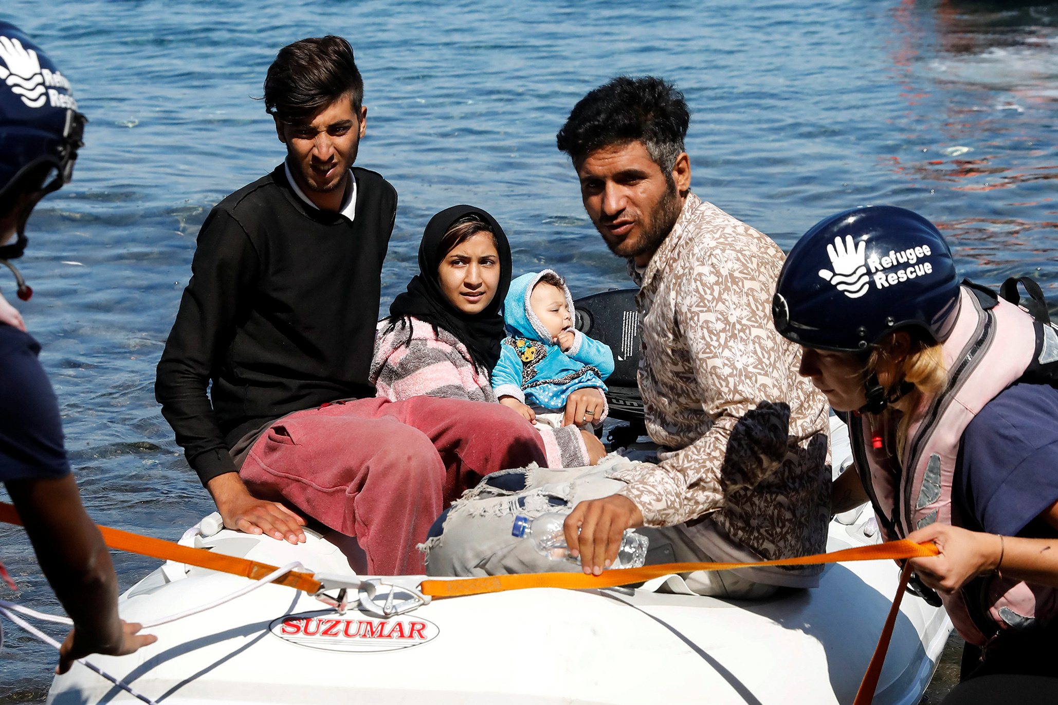 A small inflatable boat carrying migrants from Afghanistan is towed by rescuers from the Refugee Rescue NGO, near Skala Sikamineas, on the island of Lesbos, Greece, on September 16, 2019