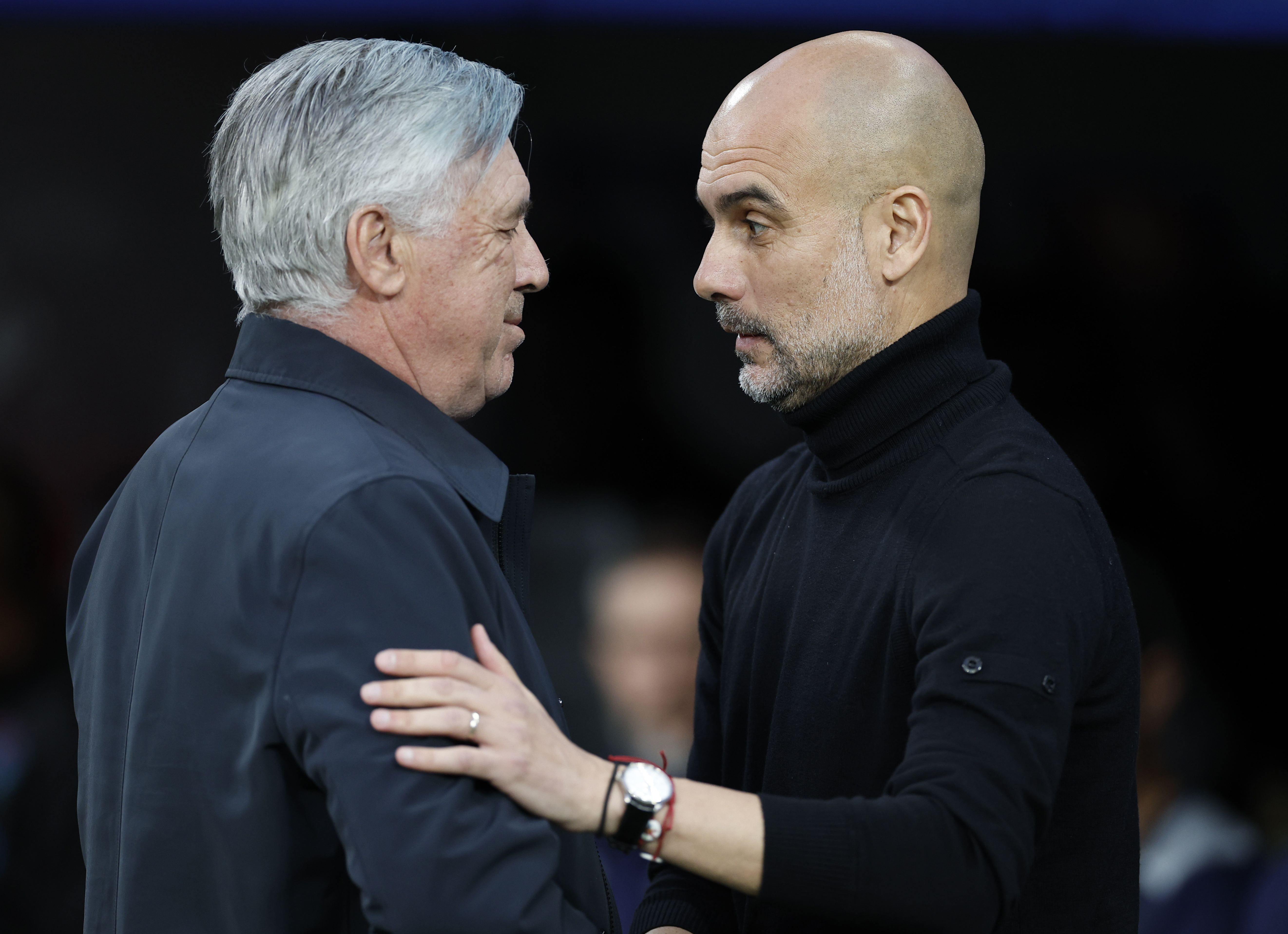 Real Madrid coach Carlo Ancelotti with Manchester City manager Pep Guardiola