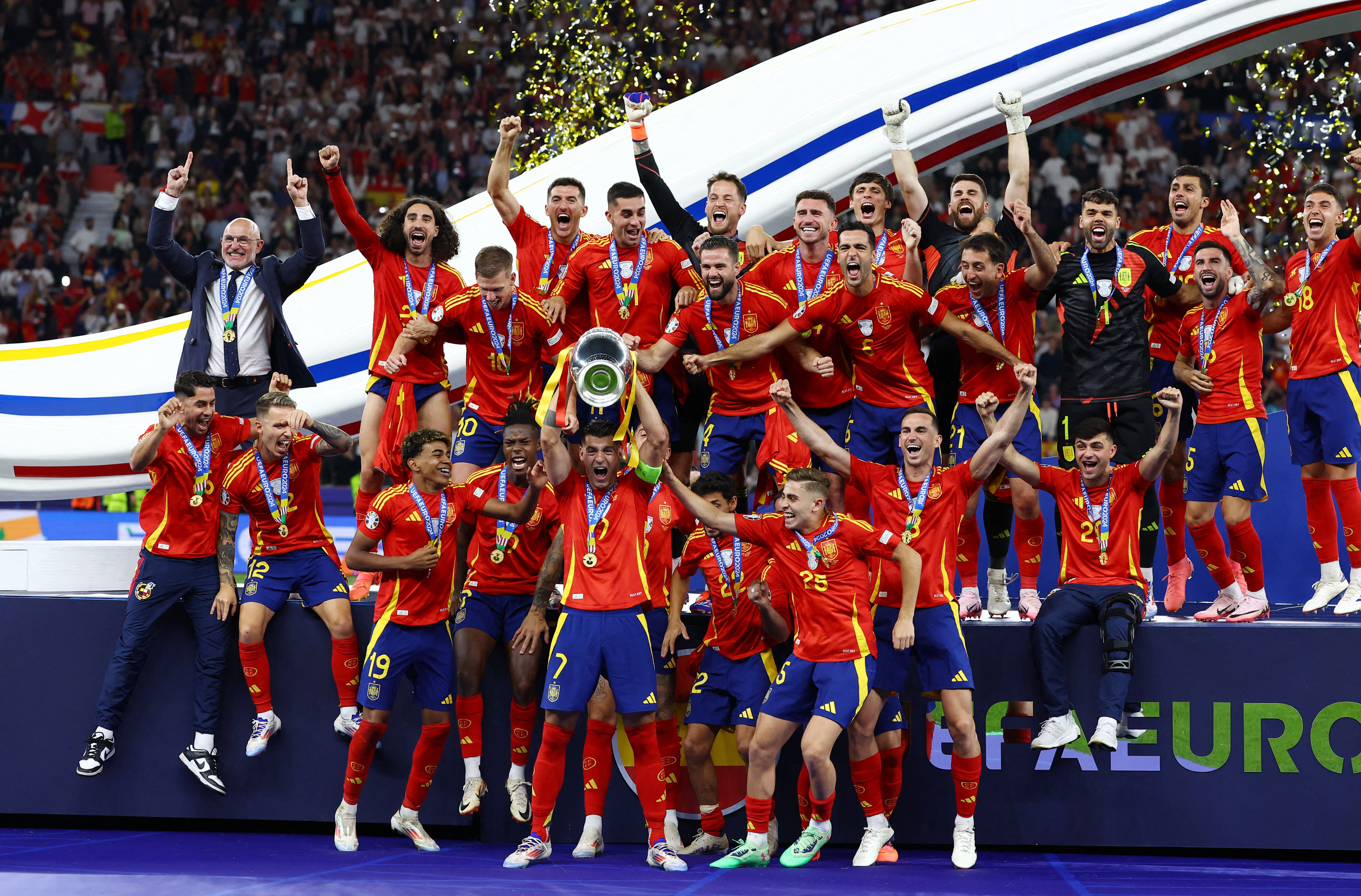 Spain's Alvaro Morata lifts the trophy as they celebrate after victory in Euro 2024