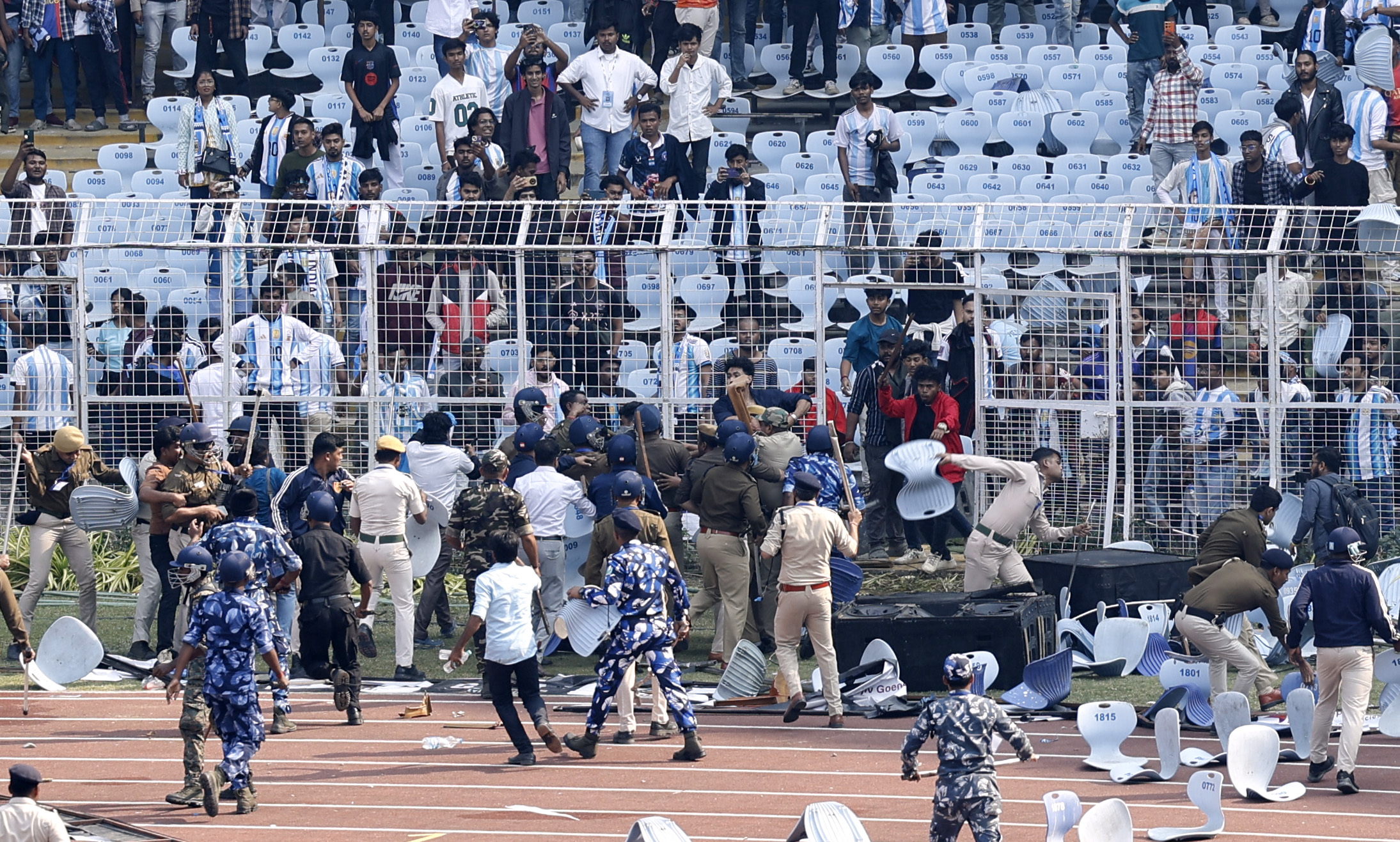 Riot police and fans clash after Argentine soccer star Lionel Messi leaves stadium in Kolkata in December 2025 [Sahiba Chawdhary/Reuters]