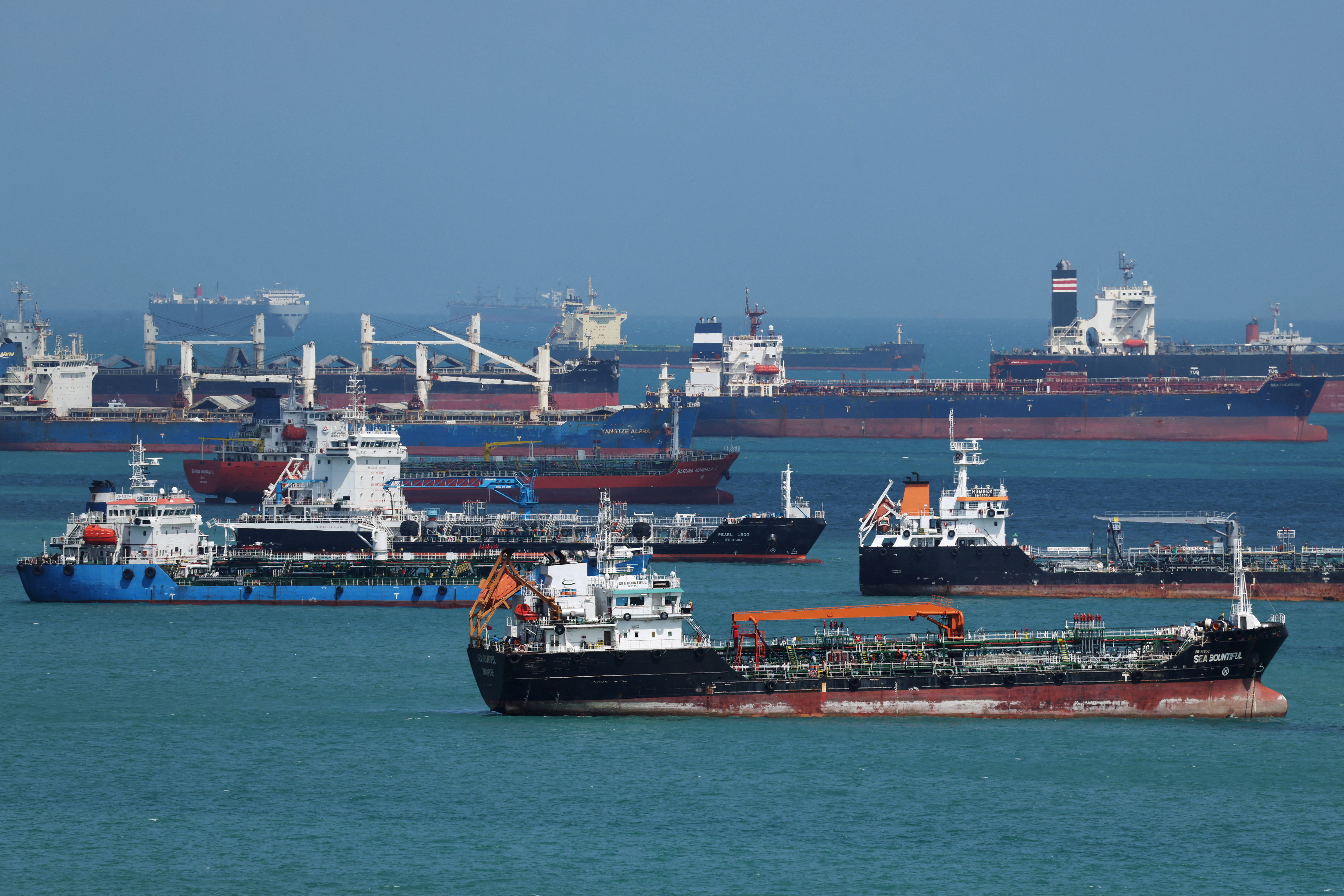 Oil tankers are seen at sea.