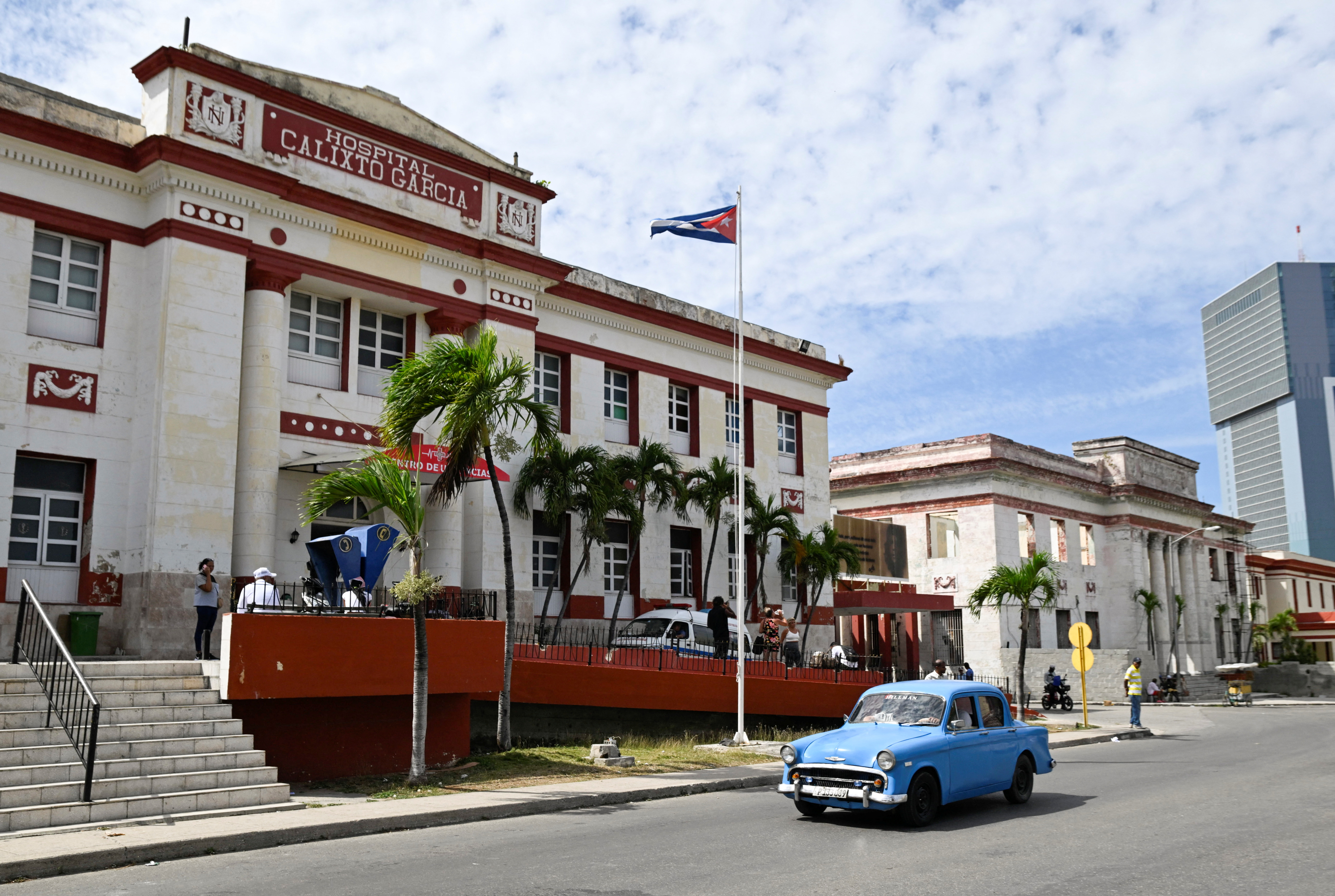 A vintage car passes by the Calixto Garcia hospital as Cuba’s once-vaunted healthcare system, long hailed as a cornerstone of the 1959 revolution, has deteriorated amid years of economic crisis and U.S. sanctions, a decline that has accelerated this year with U.S. restrictions on oil supplies, in Havana, Cuba, March 24, 2026. REUTERS/Norlys Perez