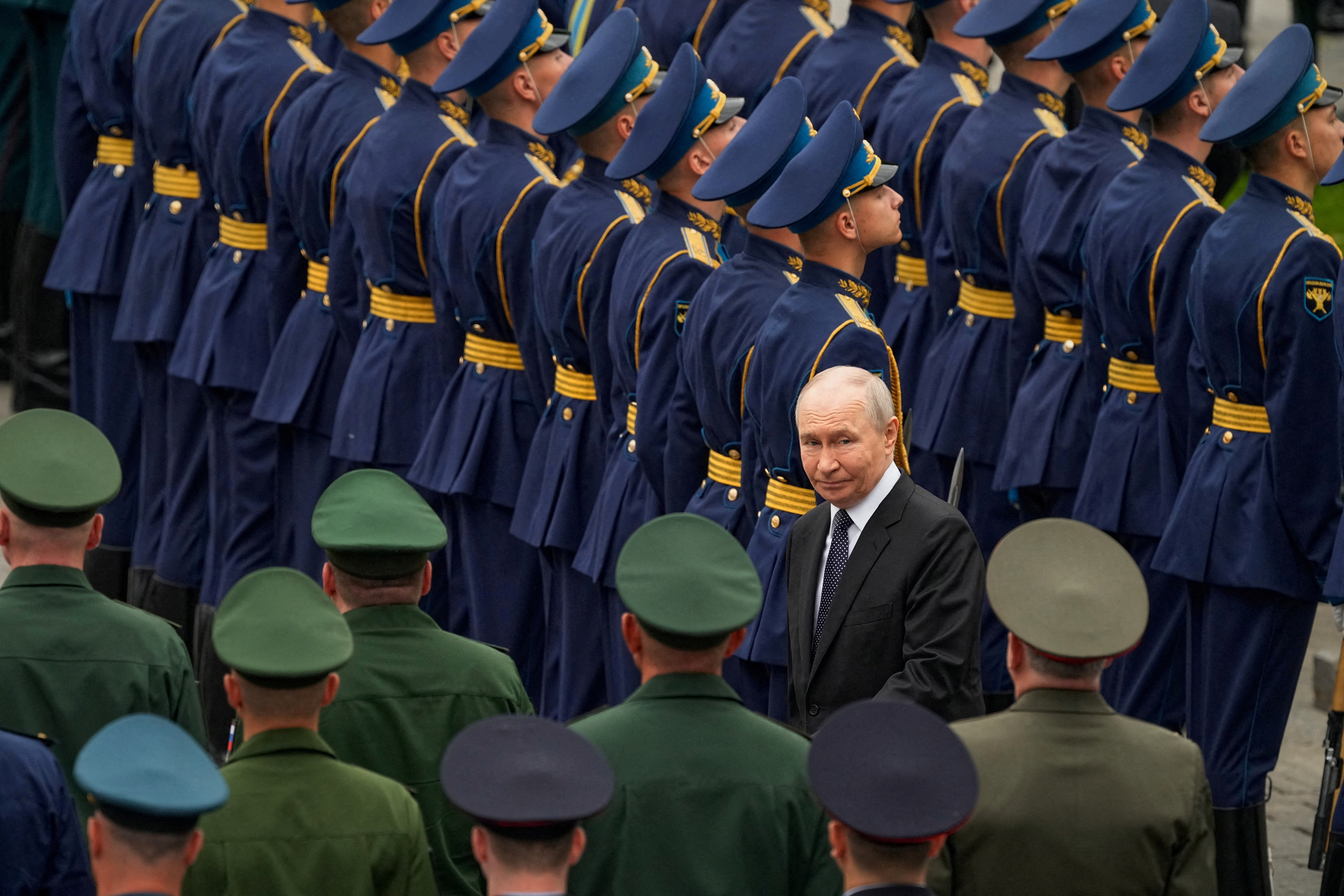 Russian President Vladimir Putin among members of the armed forces.