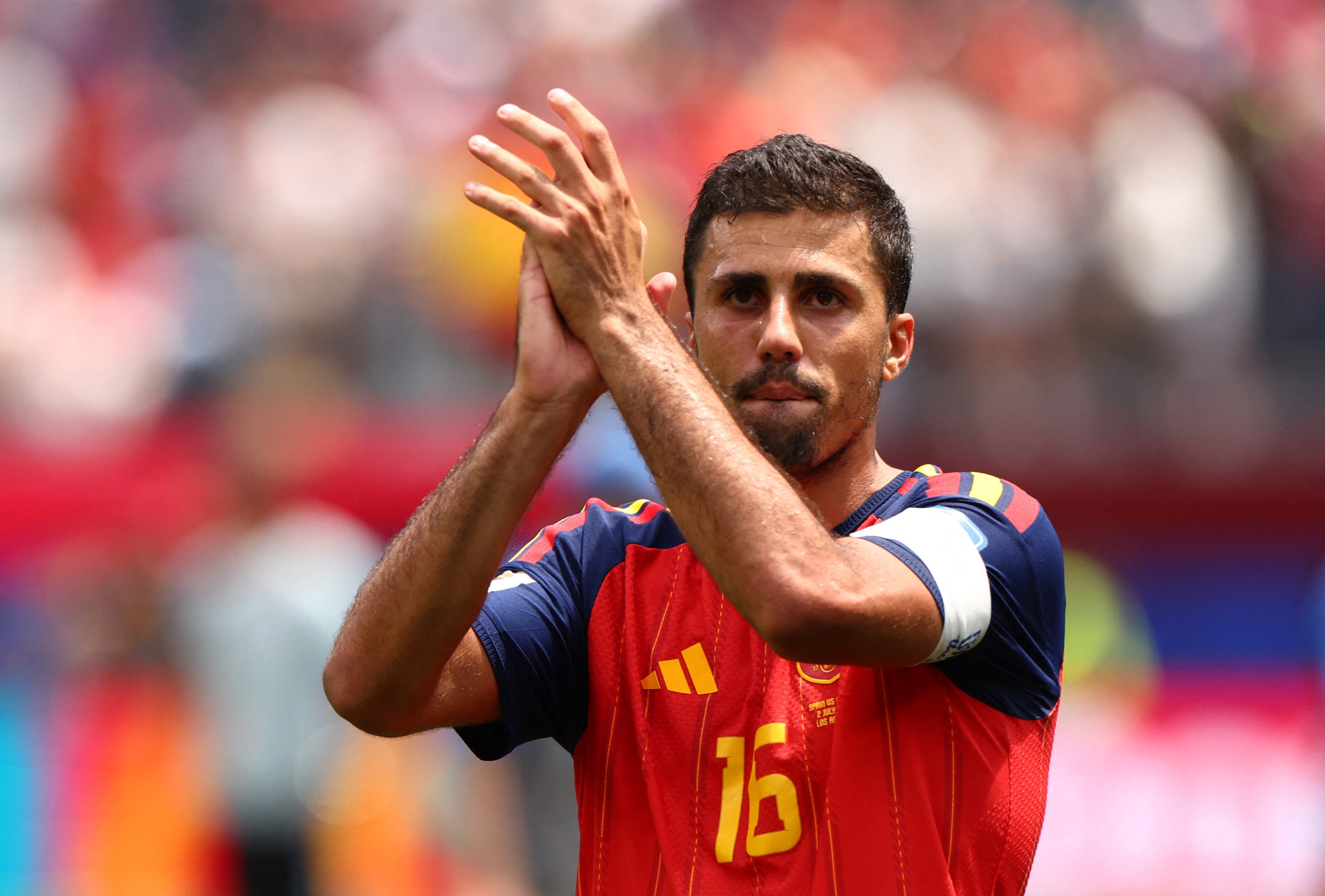 Spain’s Rodri applauds fans after the match against Austria