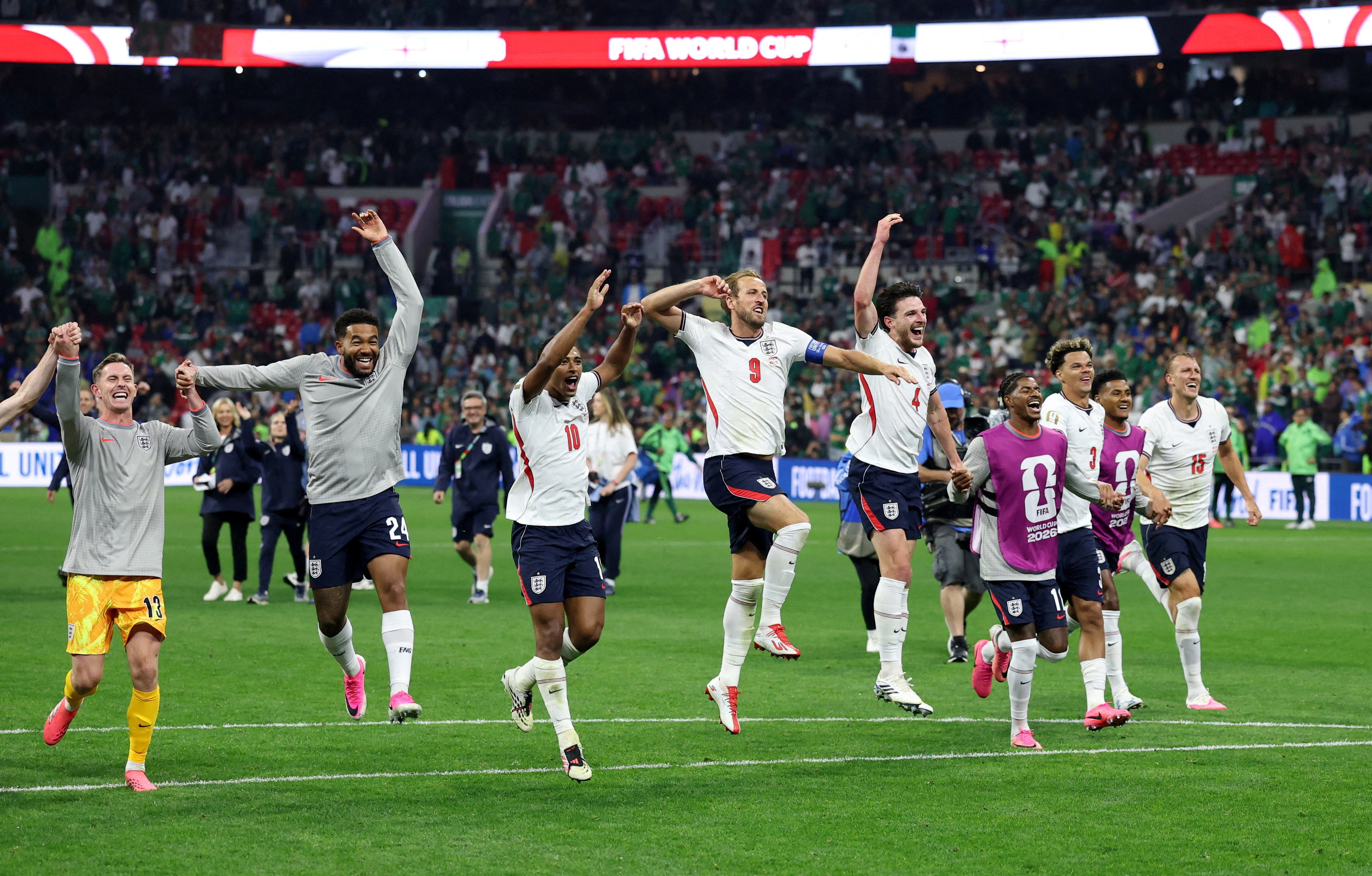 England players celebrate after reaching a third consecutive quarterfinal