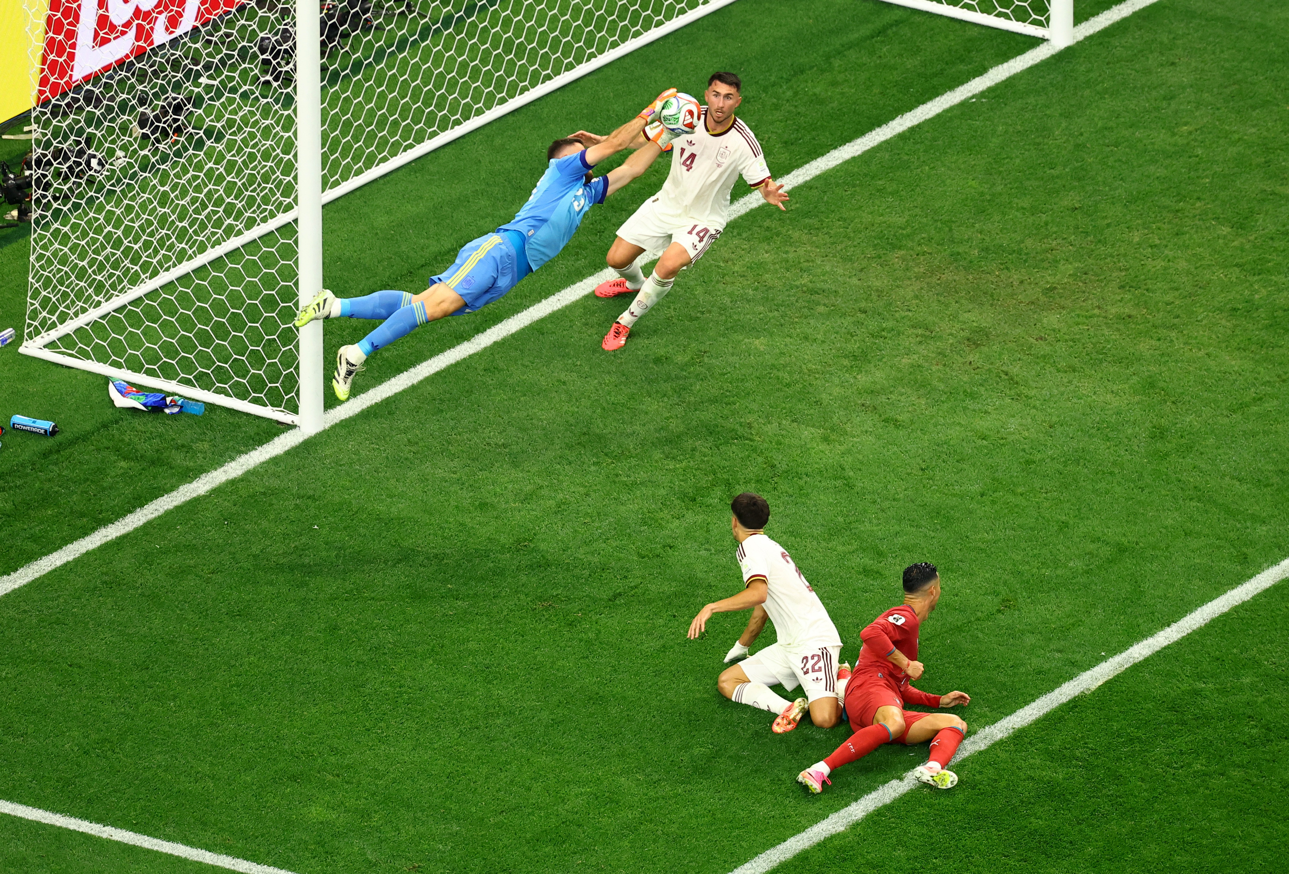 Spain's Unai Simon saves a shot on goal by Portugal's Cristiano Ronaldo