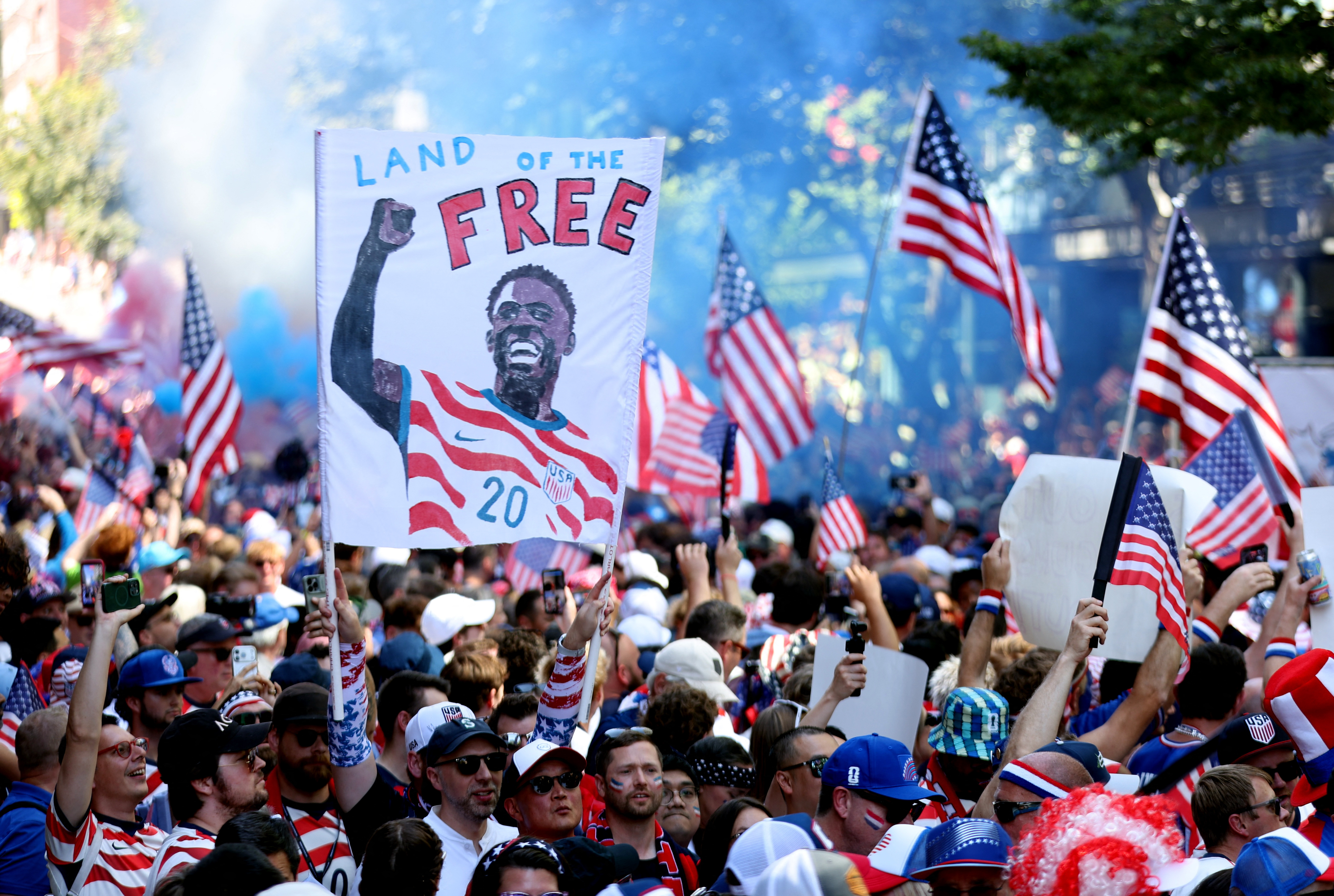 United States fans gather before the Belgium last-16 match with a Folarin Balogun banner in Seattle