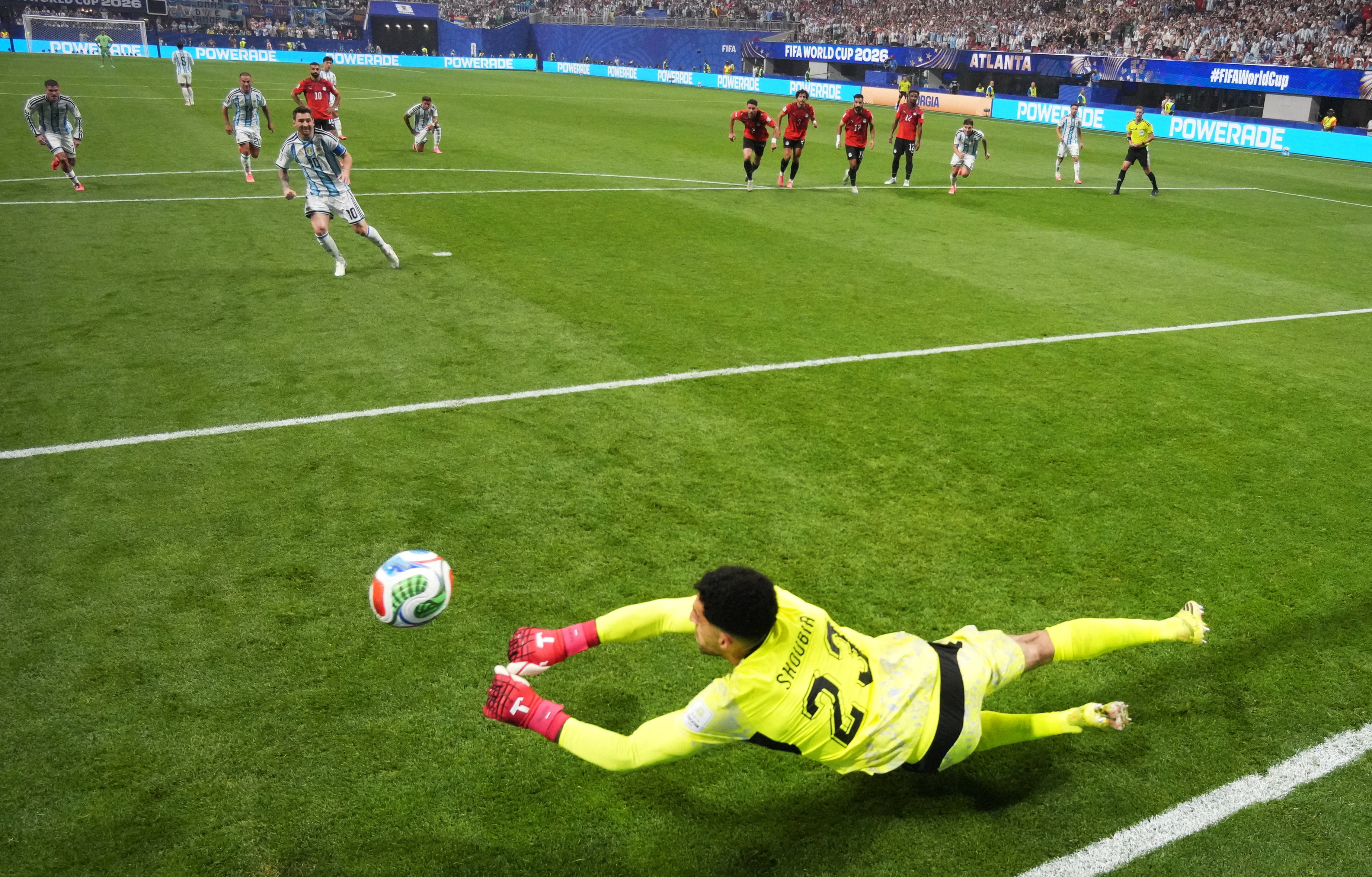 Egypt's Mostafa Shobeir saves a penalty missed by Argentina's Lionel Messi