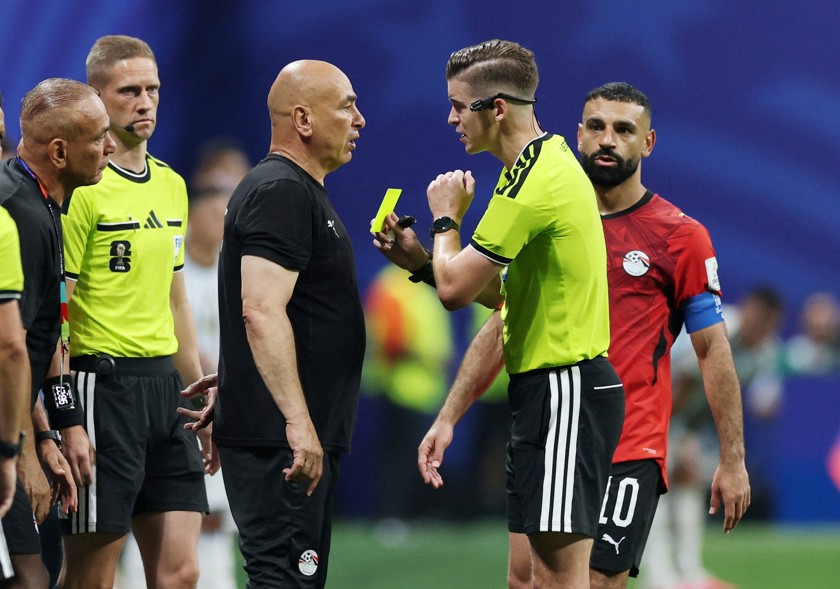 Soccer Football - FIFA World Cup 2026 - Round of 16 - Argentina v Egypt - Atlanta Stadium, Atlanta, Georgia, U.S. - July 7, 2026 Egypt coach Hossam Hassan is shown a yellow card by referee Francois Letexier REUTERS/Paul Childs TPX IMAGES OF THE DAY