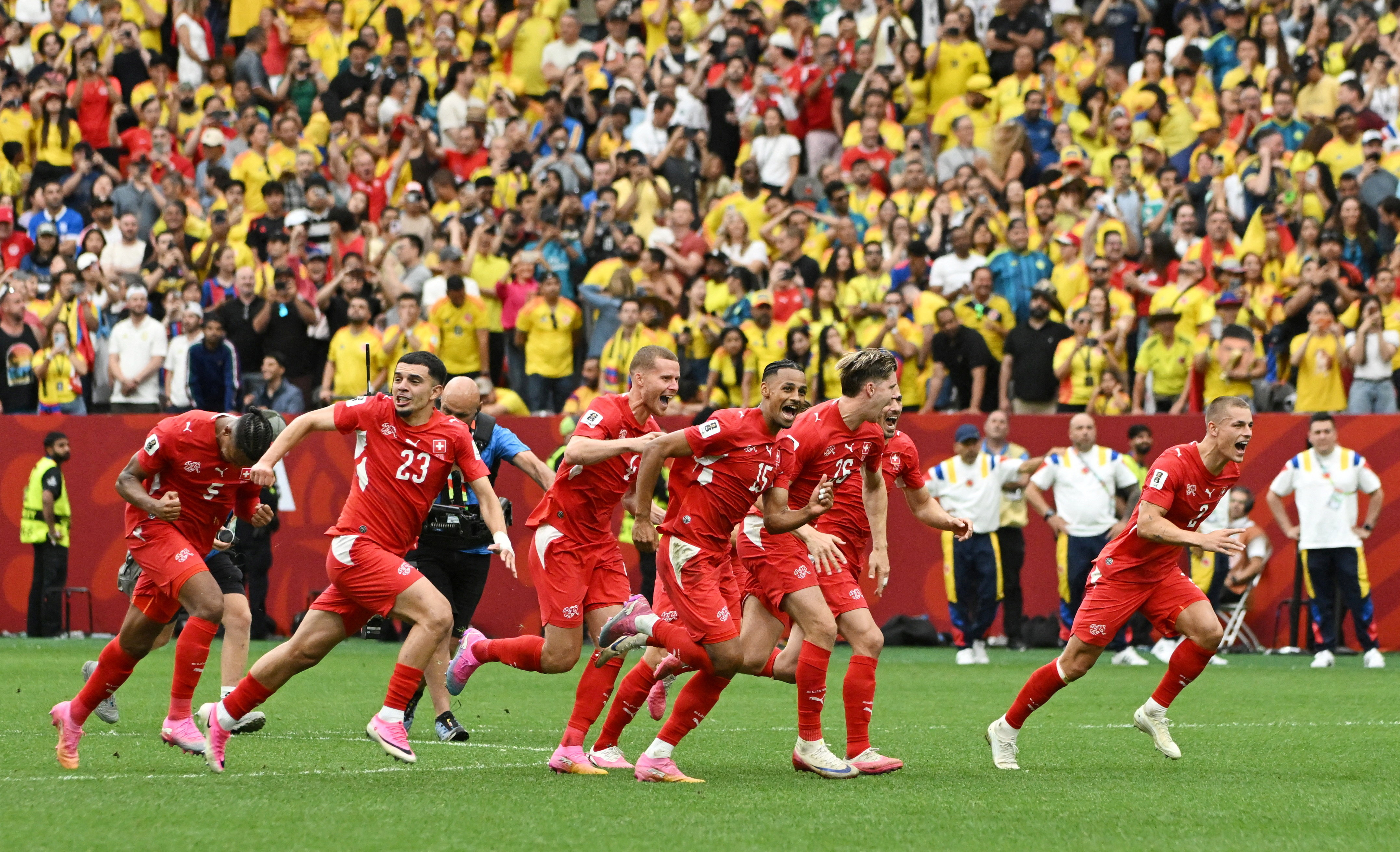 Switzerland's Djibril Sow and teammates celebrate after the penalty shootout as Switzerland qualify for the quarter finals of the World Cup