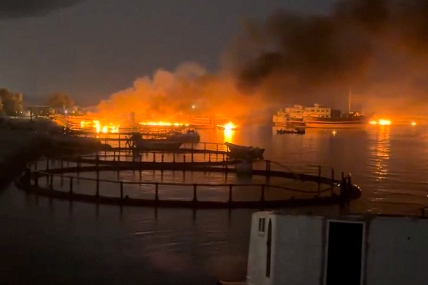Fires and smoke seen at a port.