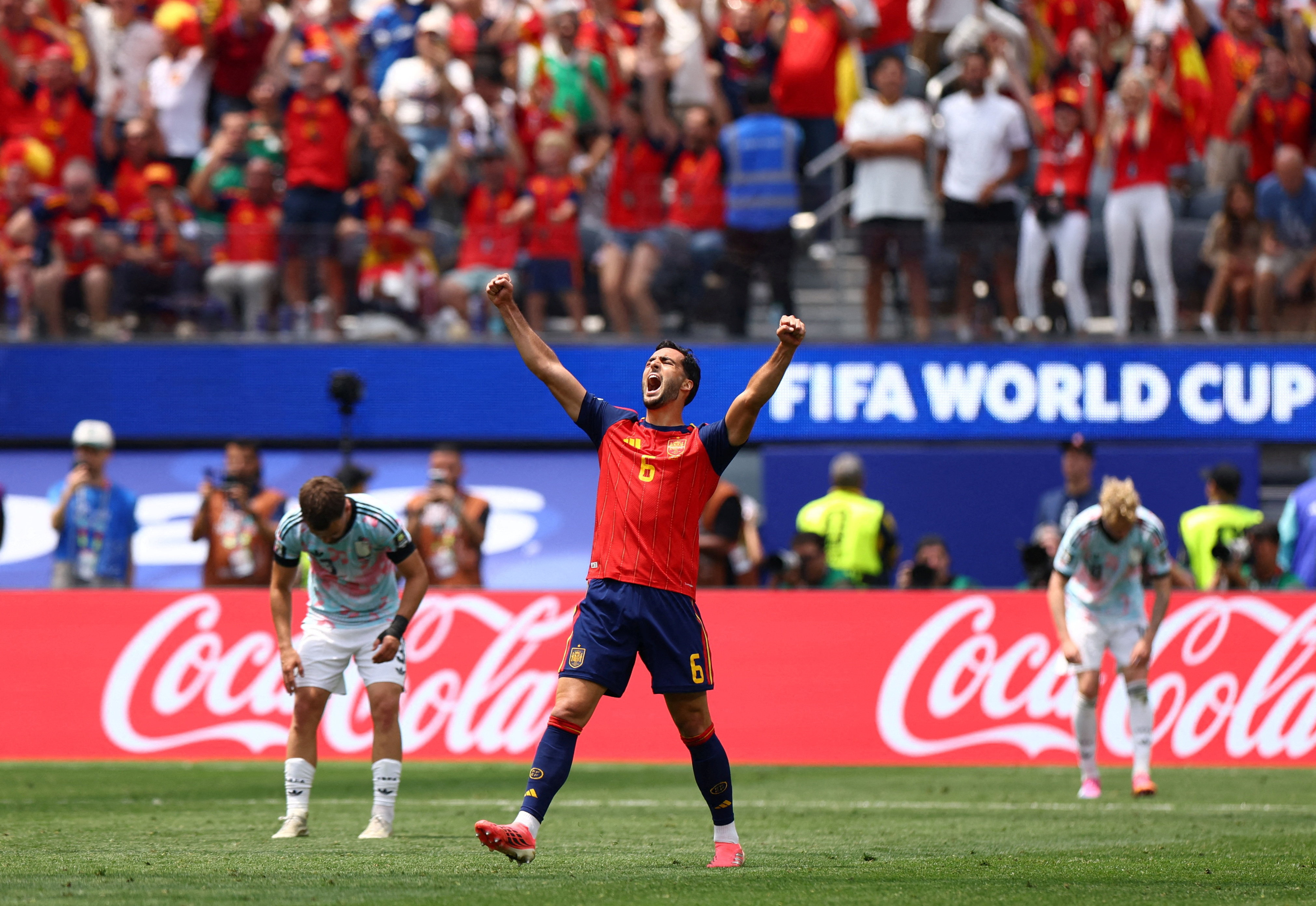 Mikel Merino celebrates as Spain qualify for the World Cup semifinals