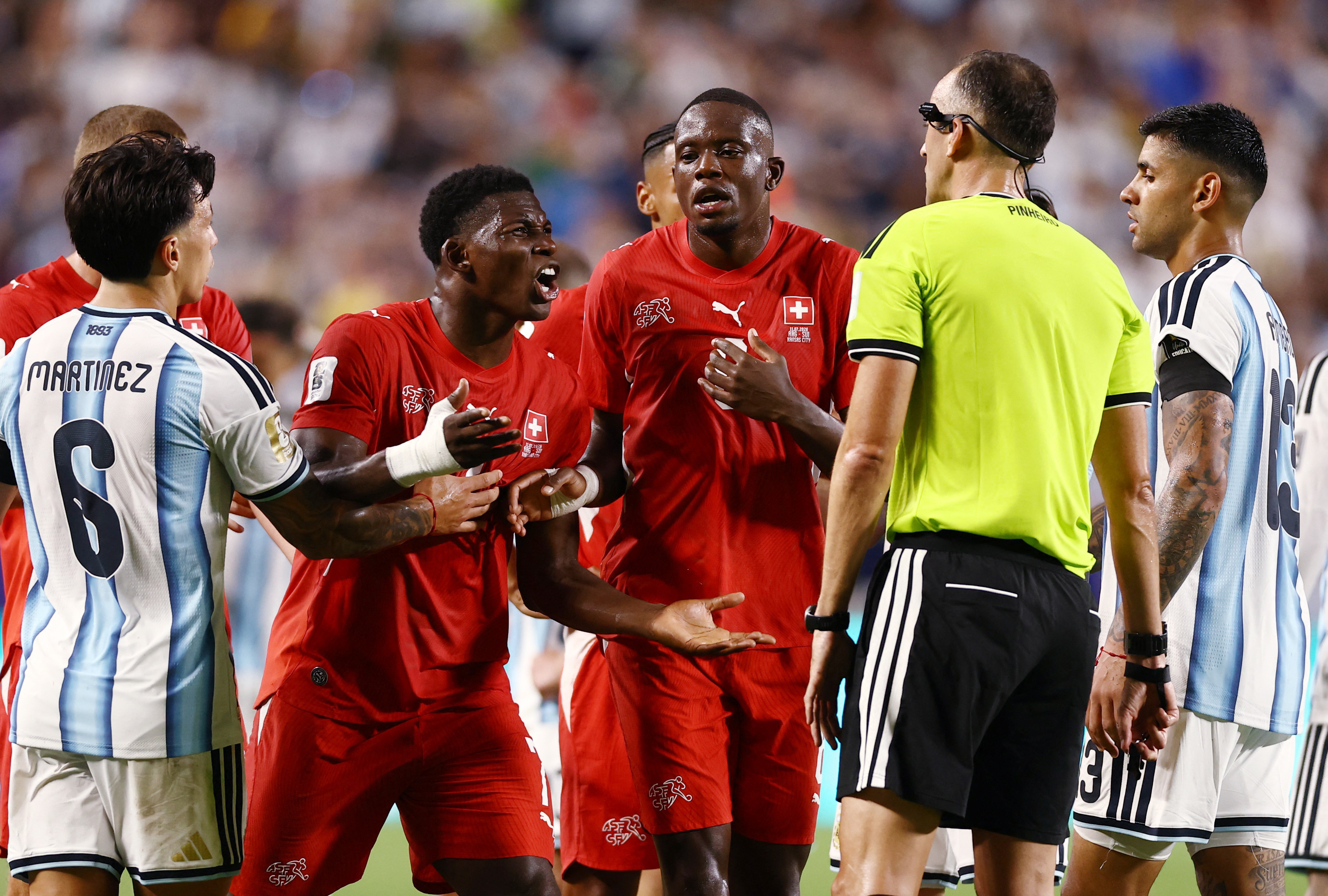 Switzerland's Breel Embolo reacts after he is shown a second yellow card and a red card by referee Joao Pinheiro following a VAR review