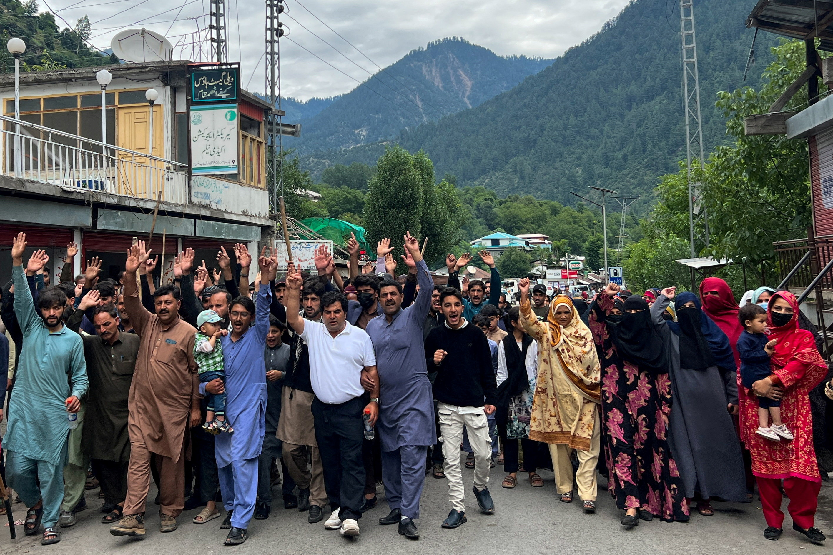 FILE PHOTO: People chant slogans as they walk during a protest and shutter-down strike called by the banned Joint Awami Action Committee (JAAC), an alliance of civil society groups, in Neelum Valley, Pakistani Kashmir, June 21, 2026. Picture taken with a mobile phone. REUTERS/Naseer ud Din/File Photo