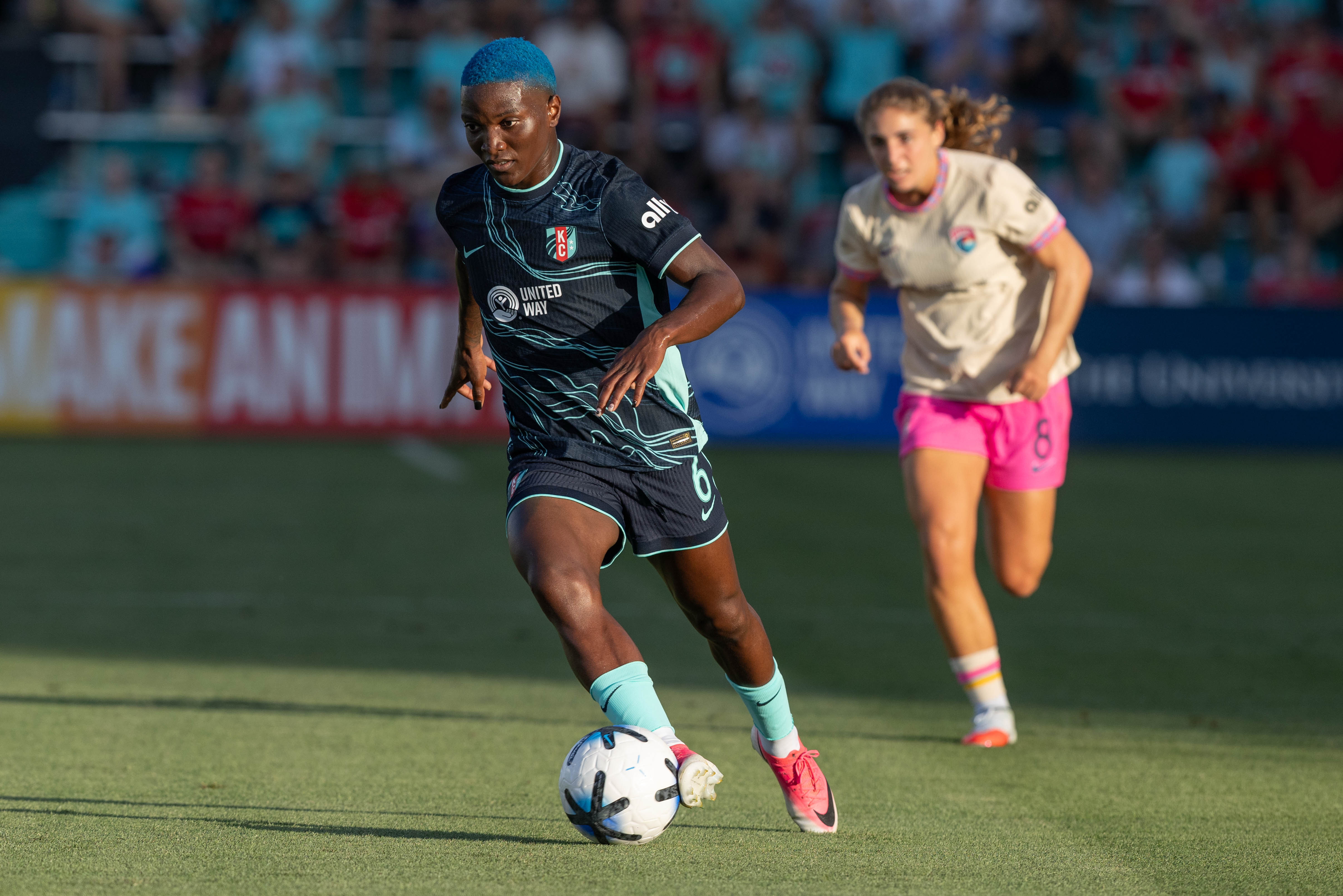 Jul 17, 2026; Kansas City, Missouri, USA; Kansas City Current forward Temwa Chawinga (6) plays the ball against San Diego Wave midfielder Kimmi Ascanio (8) during the first half at CPKC Stadium. Mandatory Credit: Kylie Graham-Imagn Images