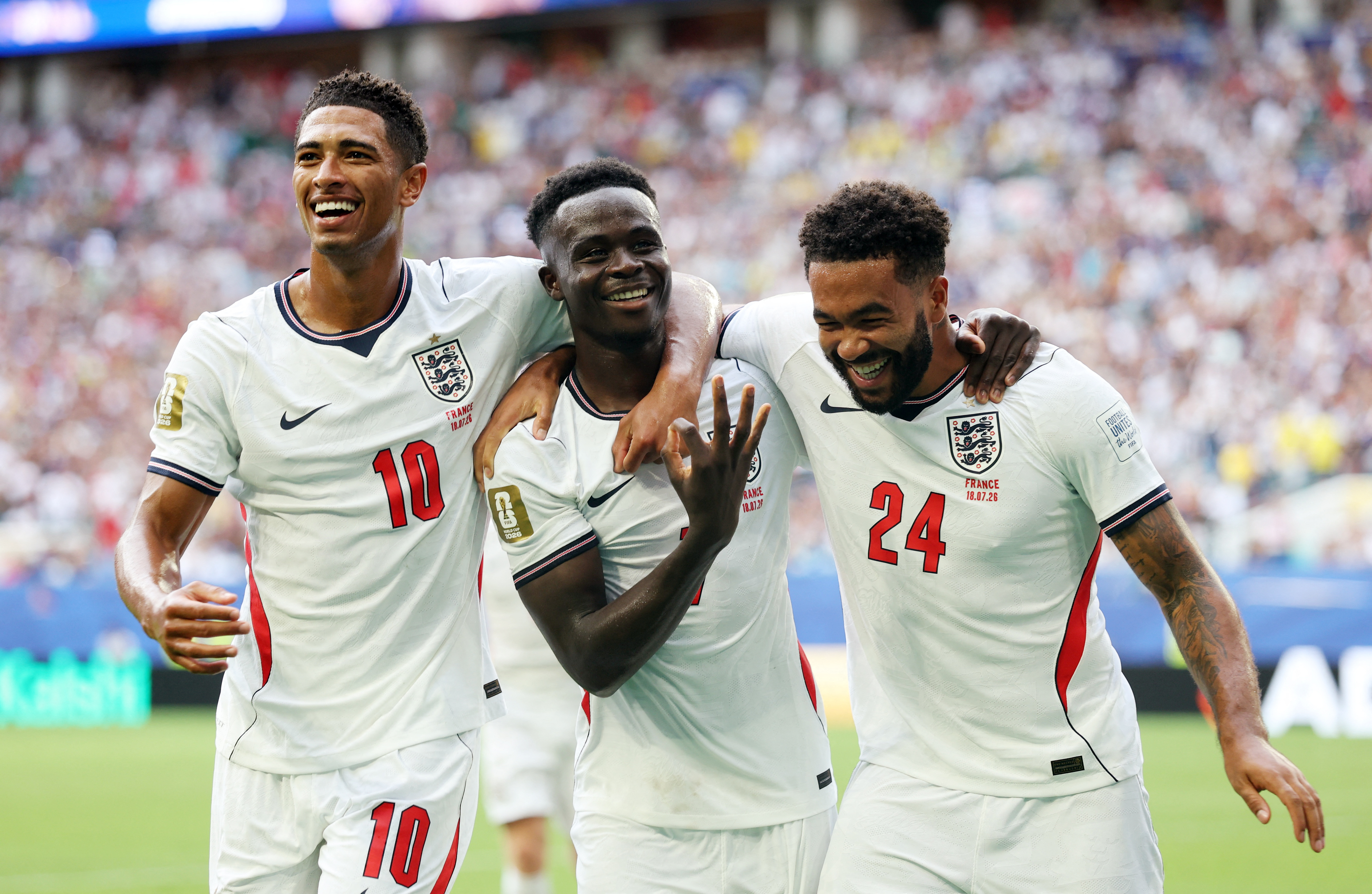 England's Bukayo Saka celebrates scoring their fifth goal to complete a hat-trick with Jude Bellingham and Reece James
