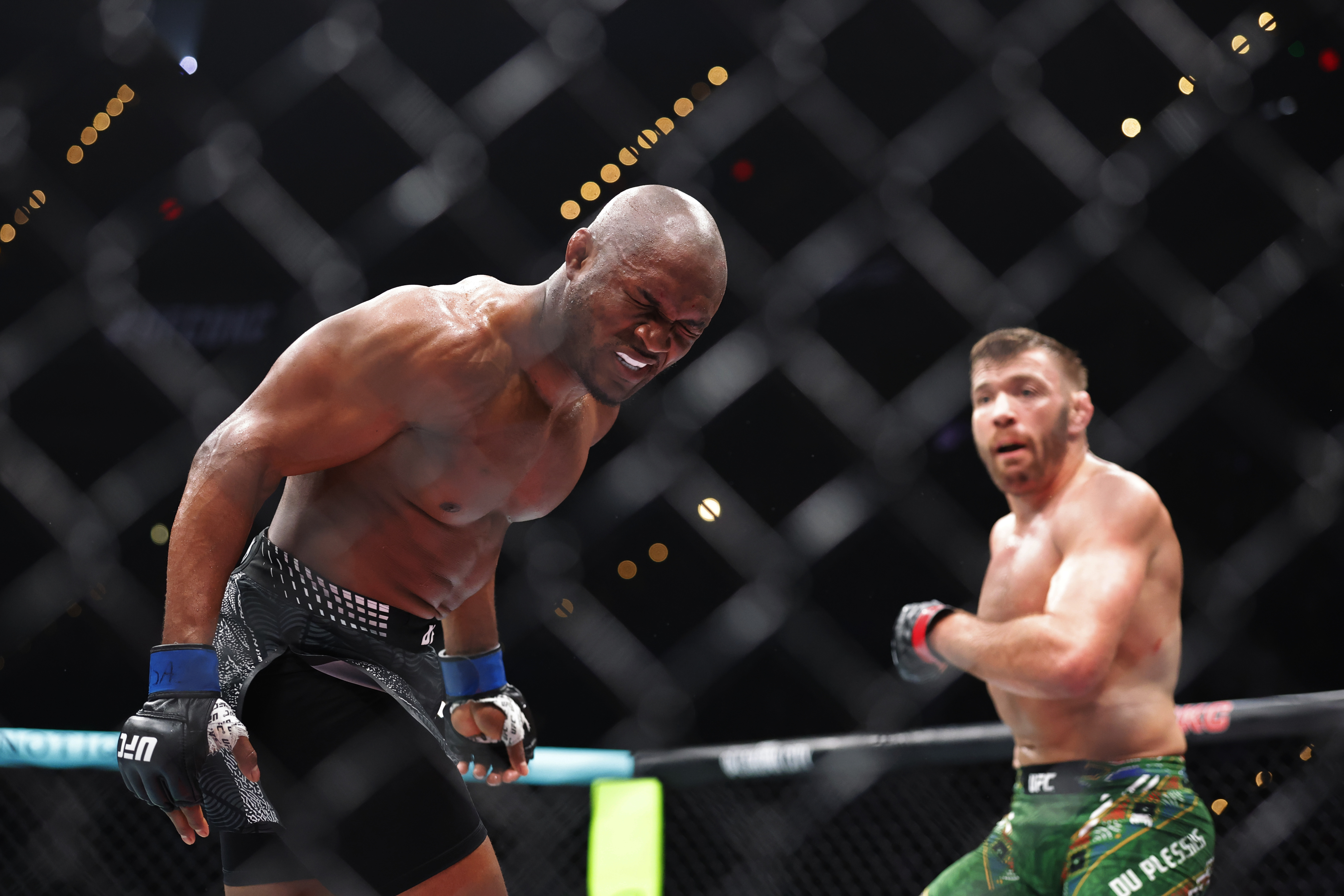 Jul 18, 2026; Oklahoma City, Oklahoma, USA; Dricus Du Plessis (red gloves) fights Kamaru Usman (blue gloves) during UFC Fight Night at Paycom Center. Mandatory Credit: Alonzo Adams-Imagn Images