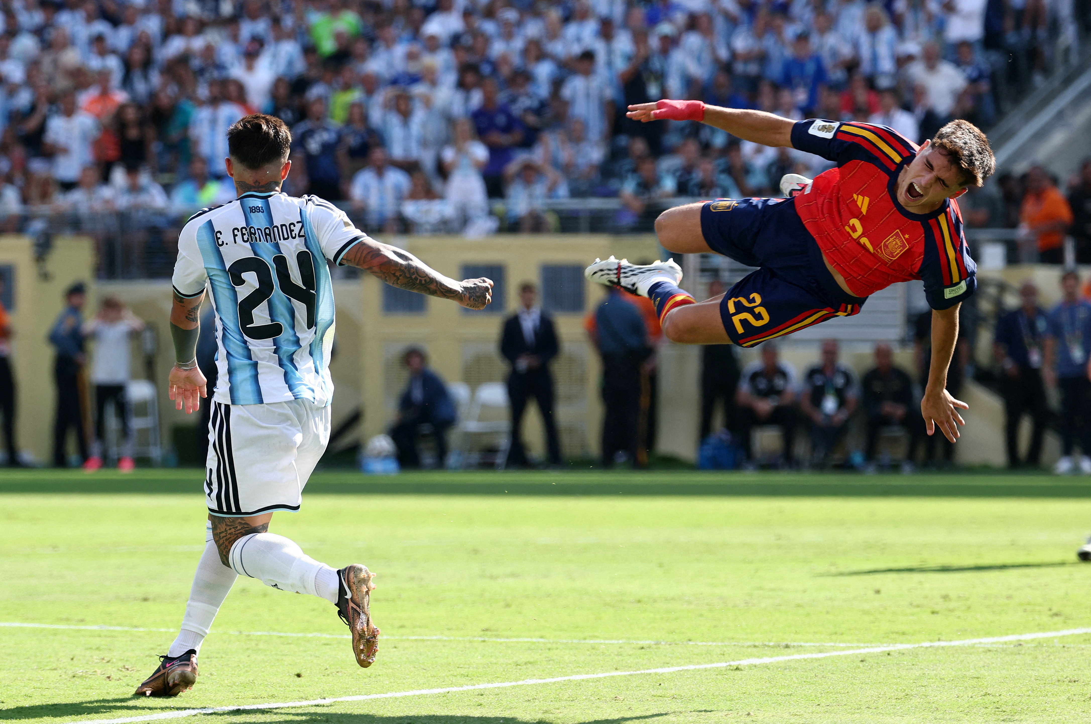 Argentina’s Enzo Fernandez fouls Spain’s Pau Cubarsi and is later shown a second yellow card before being shown a red card