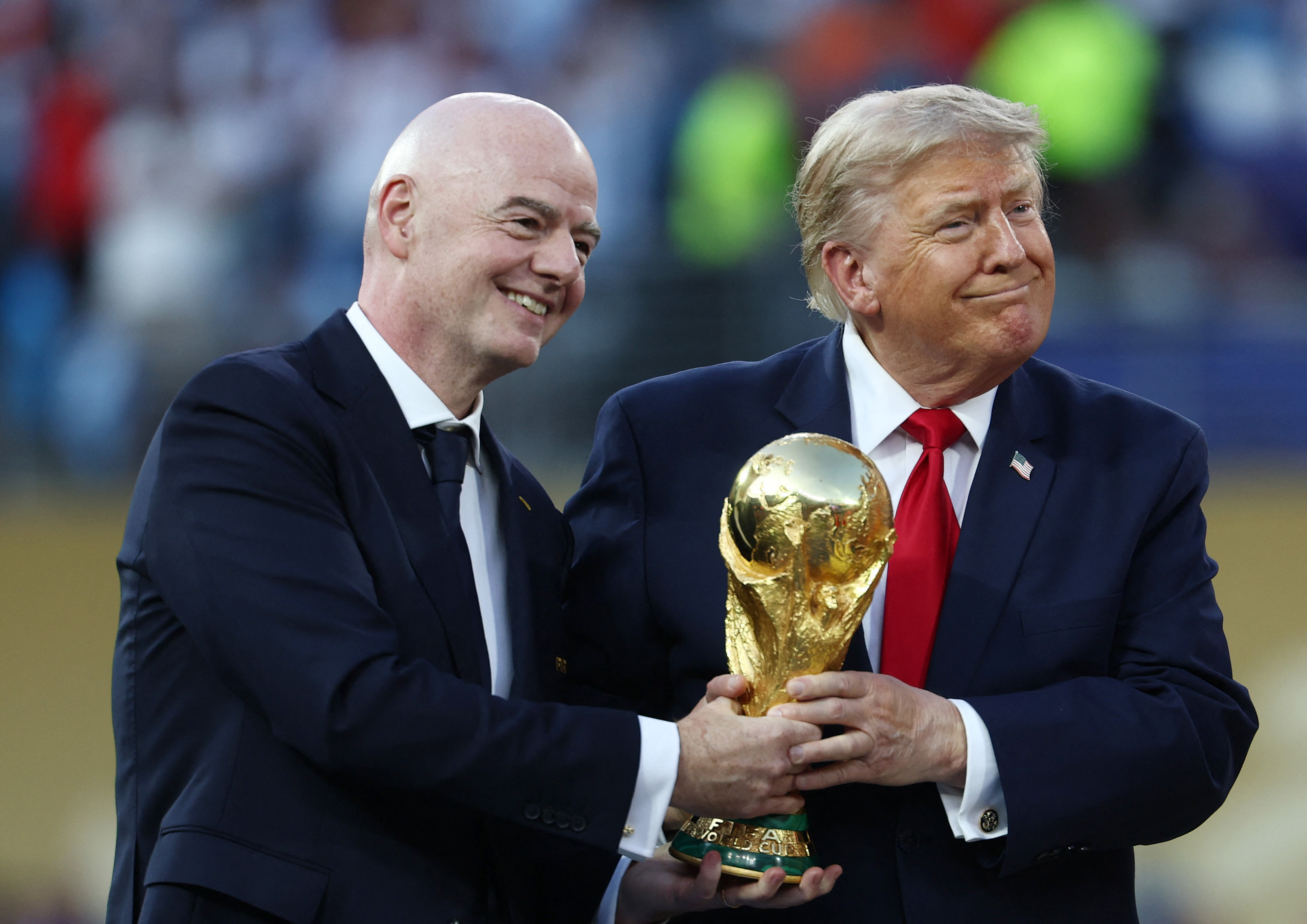 US President Donald Trump and FIFA President Gianni Infantino with the World Cup trophy