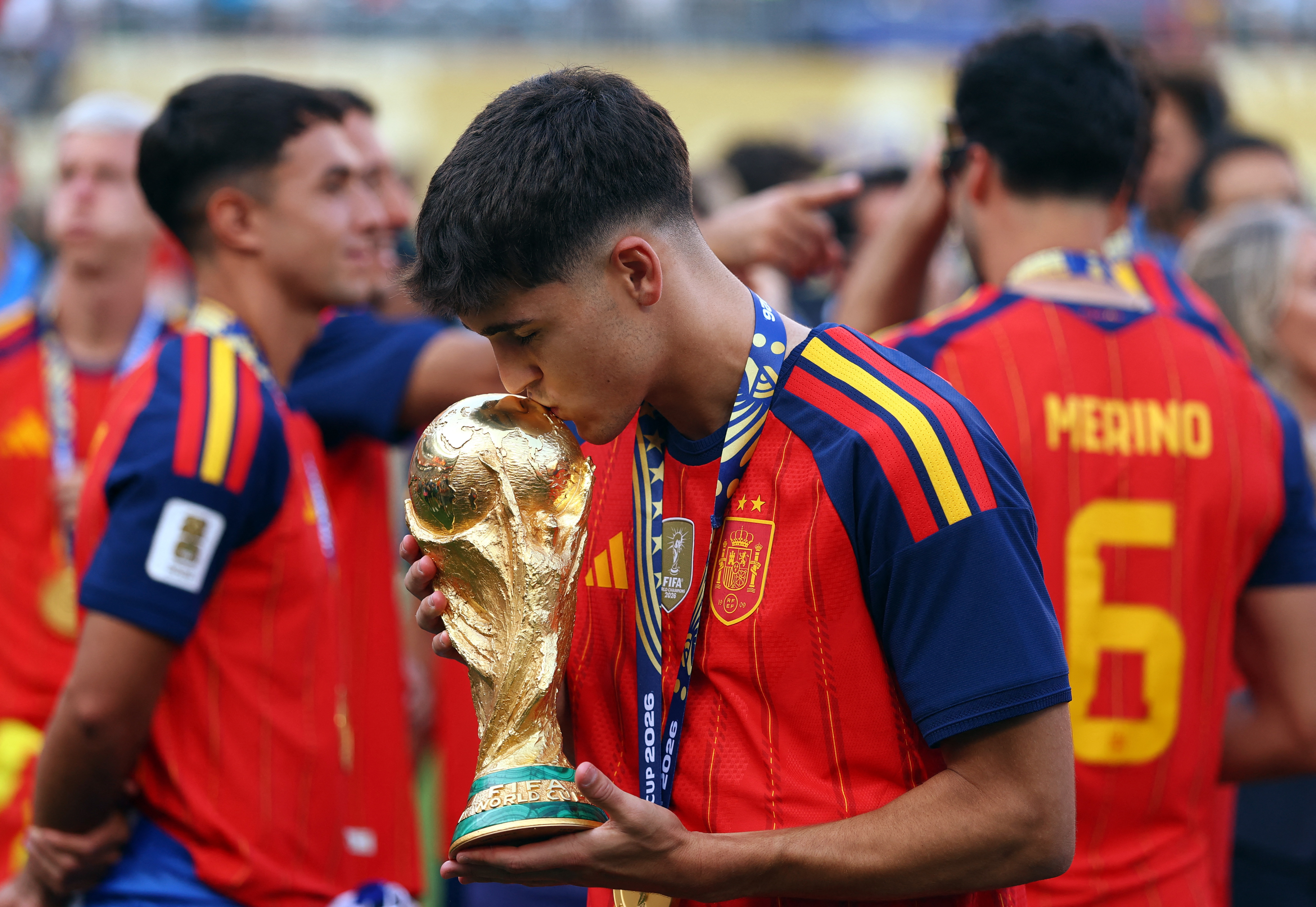 Spain’s Pau Cubarsi kisses the trophy after winning the World Cup