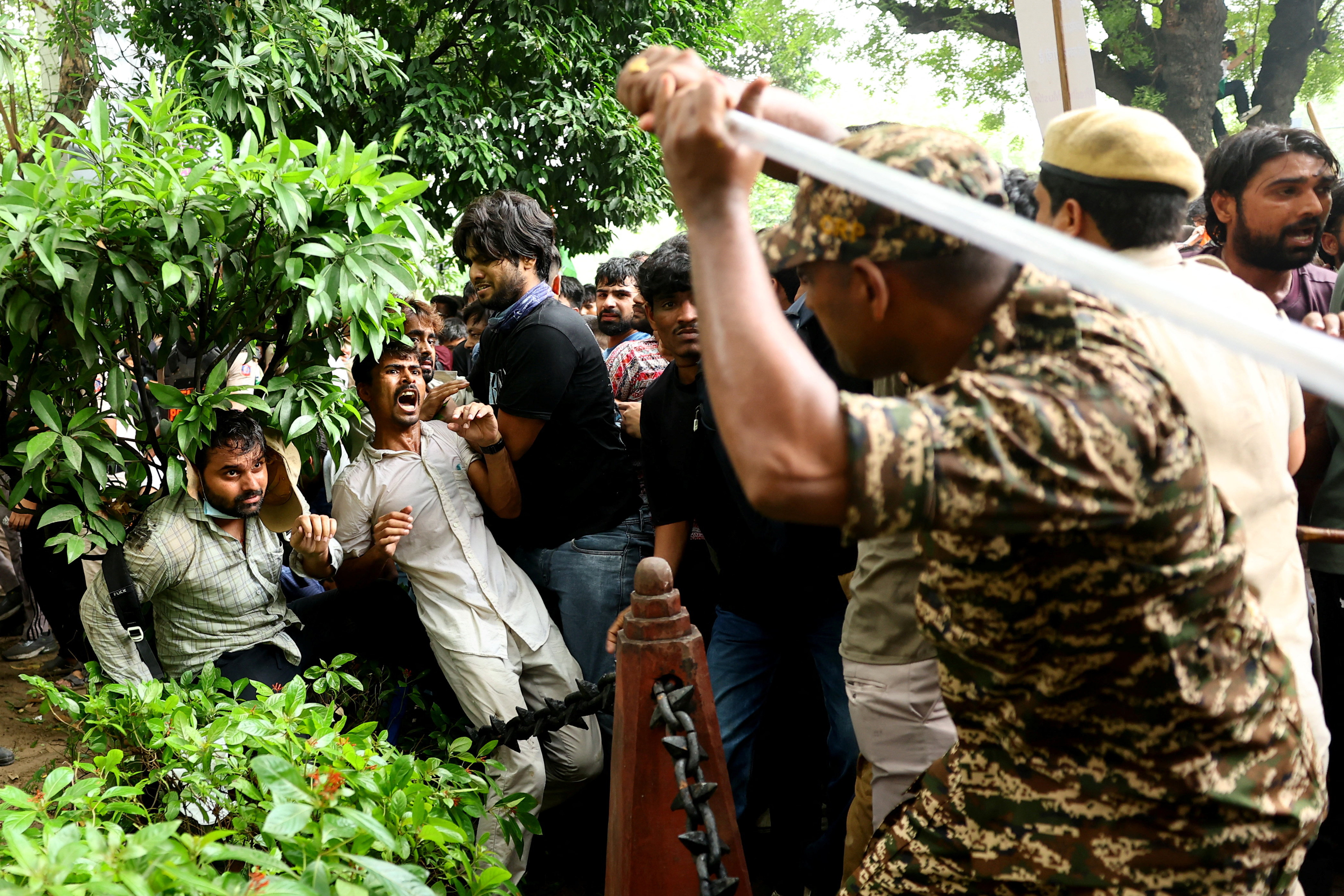 Police fire tear gas at India's Cockroach movement supporters