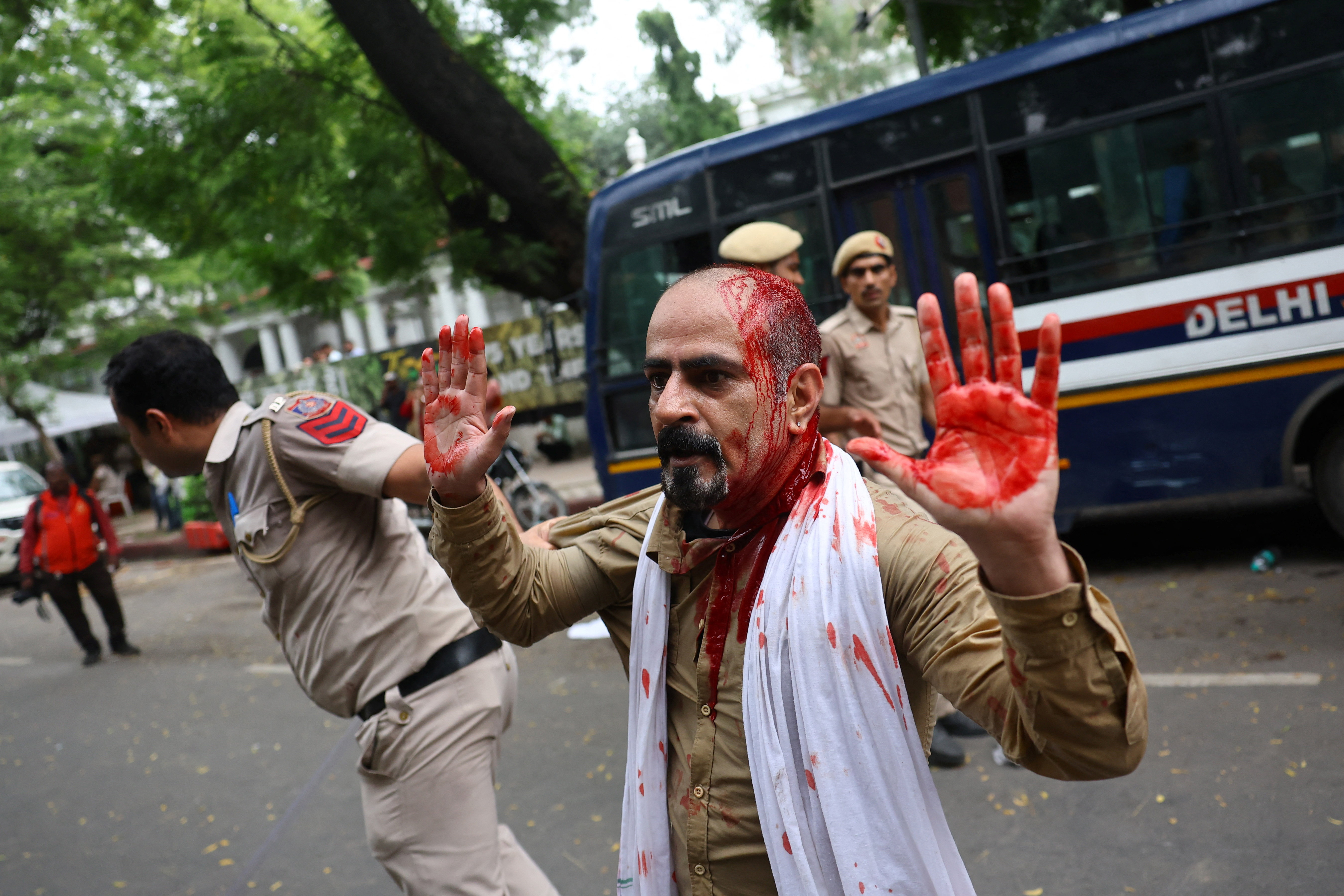 Police fire tear gas at India's Cockroach movement supporters