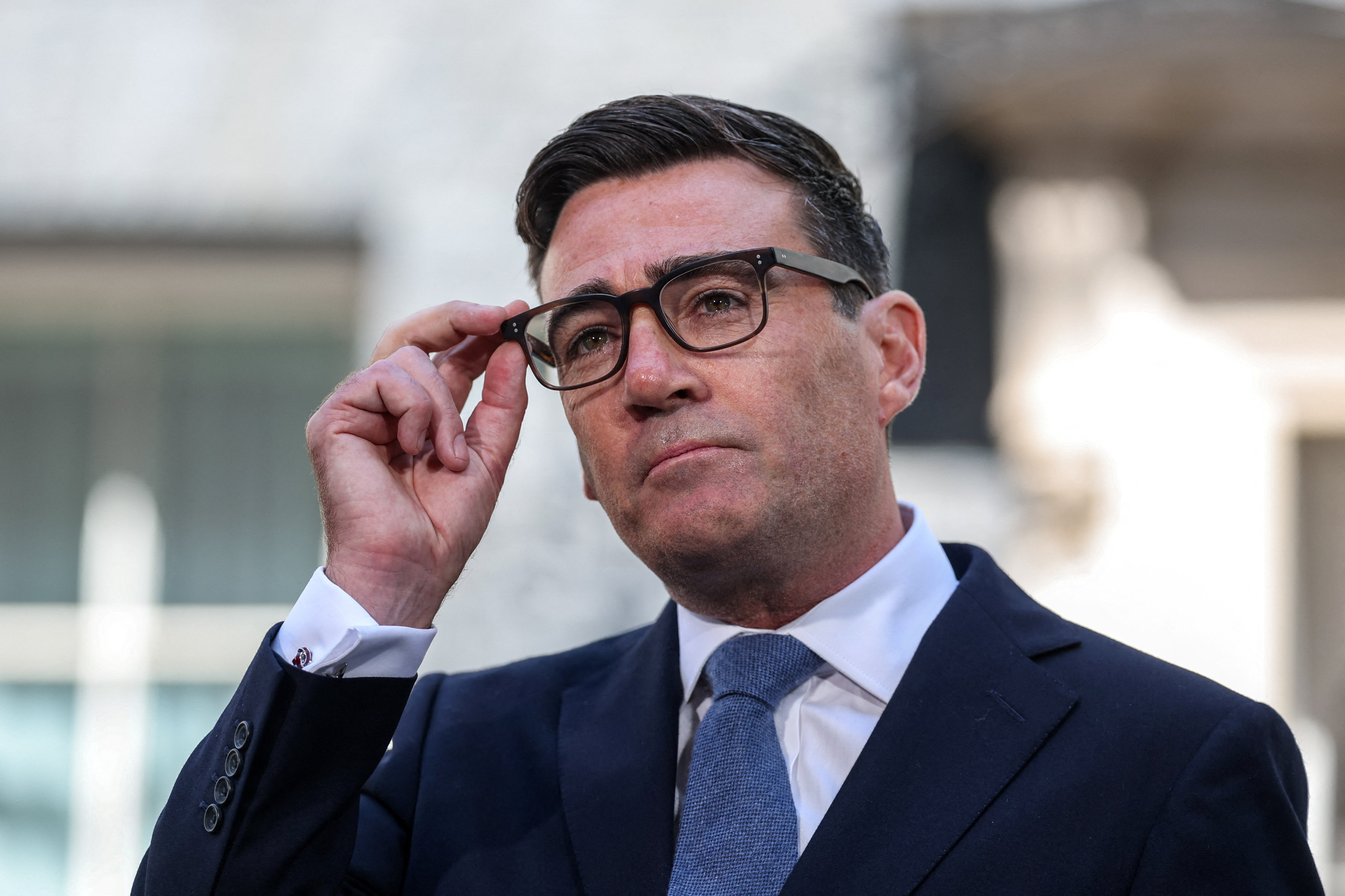 Britain's newly appointed Prime Minister Andy Burnham adjusts his glasses outside 10 Downing Street after taking office, in London, Britain, July 20, 2026. REUTERS/Isabel Infantes