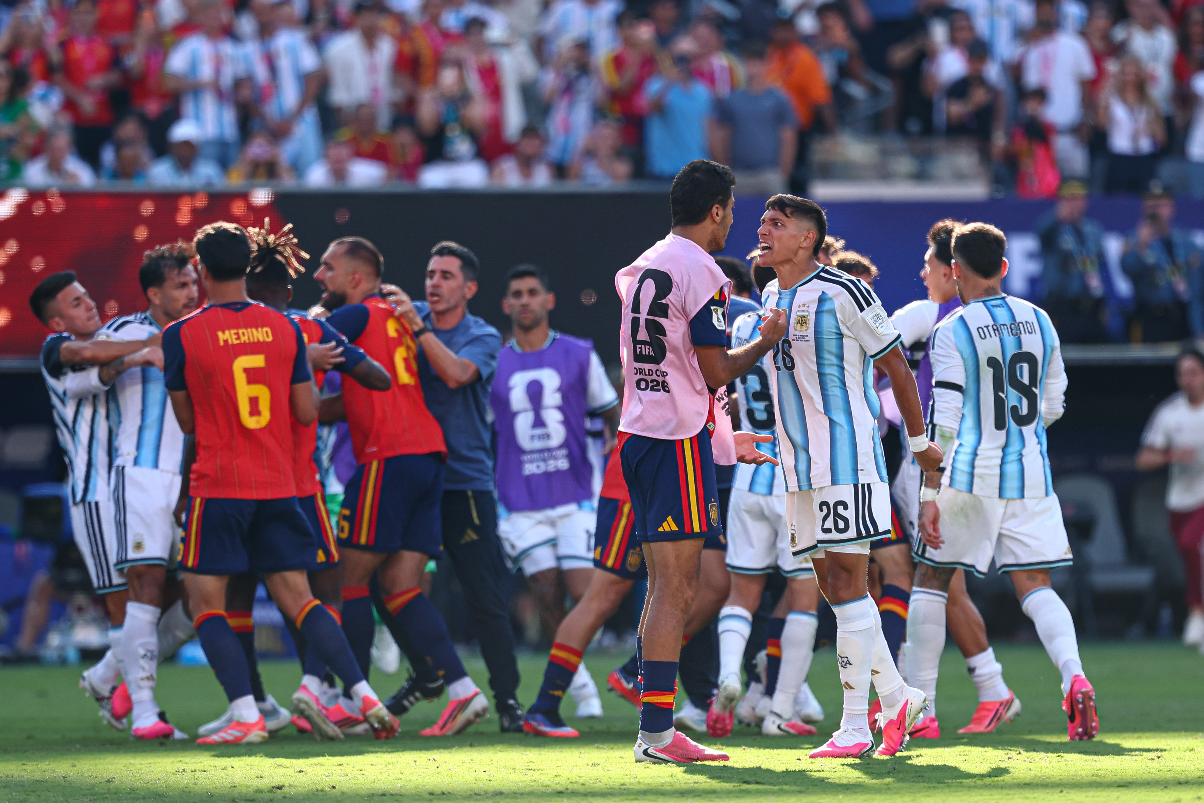Argentina defender Nahuel Molina argues with Spain midfielder Rodri as players scuffle after the FIFA World Cup final