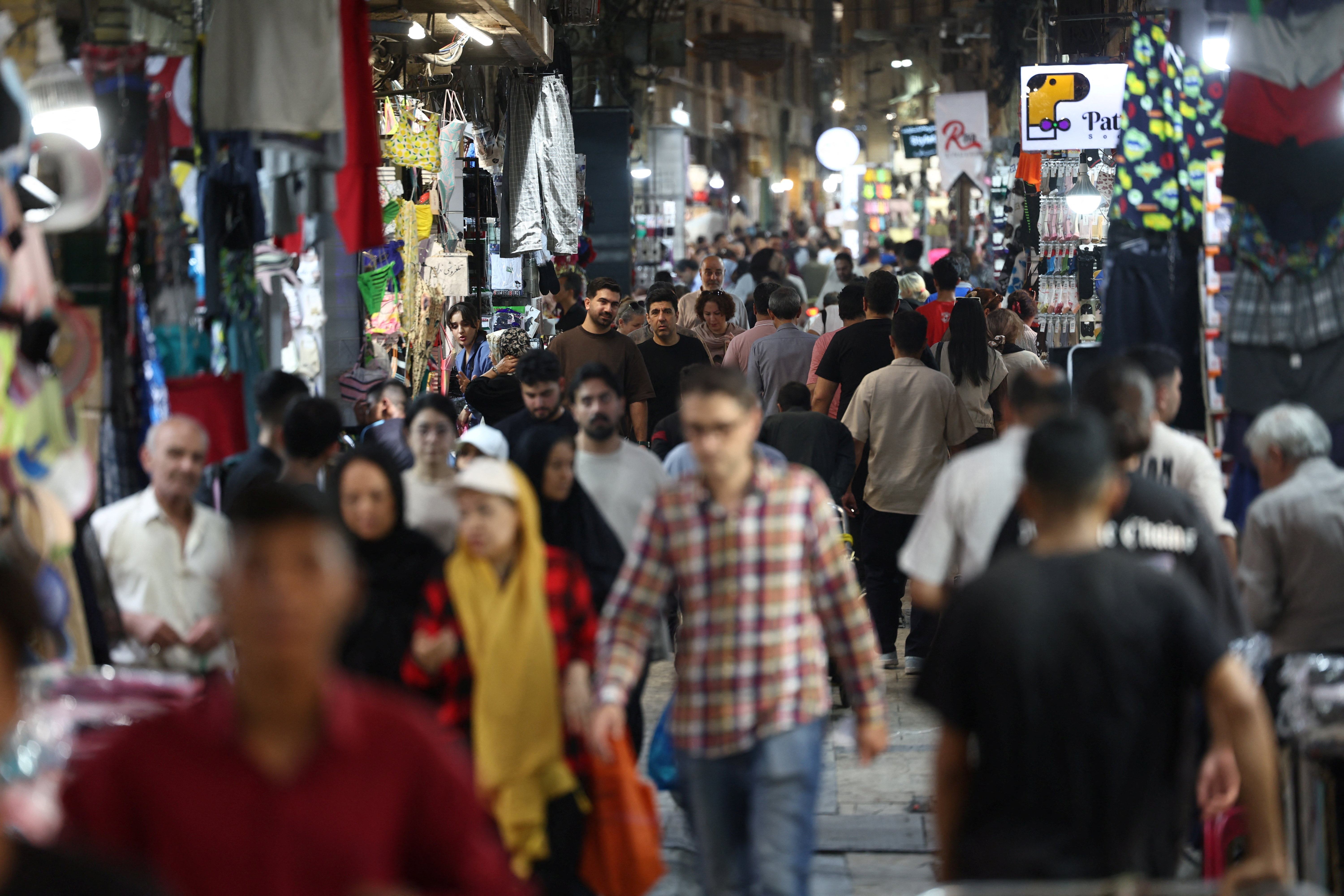 People walk in the Grand Bazaar, in Tehran, Iran, July 20, 2026. Majid Asgaripour/WANA (West Asia News Agency) via REUTERS ATTENTION EDITORS - THIS PICTURE WAS PROVIDED BY A THIRD PARTY. ISRAEL OUT. NO COMMERCIAL OR EDITORIAL SALES IN ISRAEL. NO ACCESS FOR ISRAELI MEDIA. NO USE BBC PERSIAN. NO USE VOA PERSIAN. NO USE MANOTO. NO USE IRAN INTERNATIONAL. NO USE RADIO FARDA. DIGITAL: NO USE BBC PERSIAN. NO USE VOA PERSIAN. NO USE MANOTO. NO USE IRAN INTERNATIONAL. NO USE RADIO FARDA.