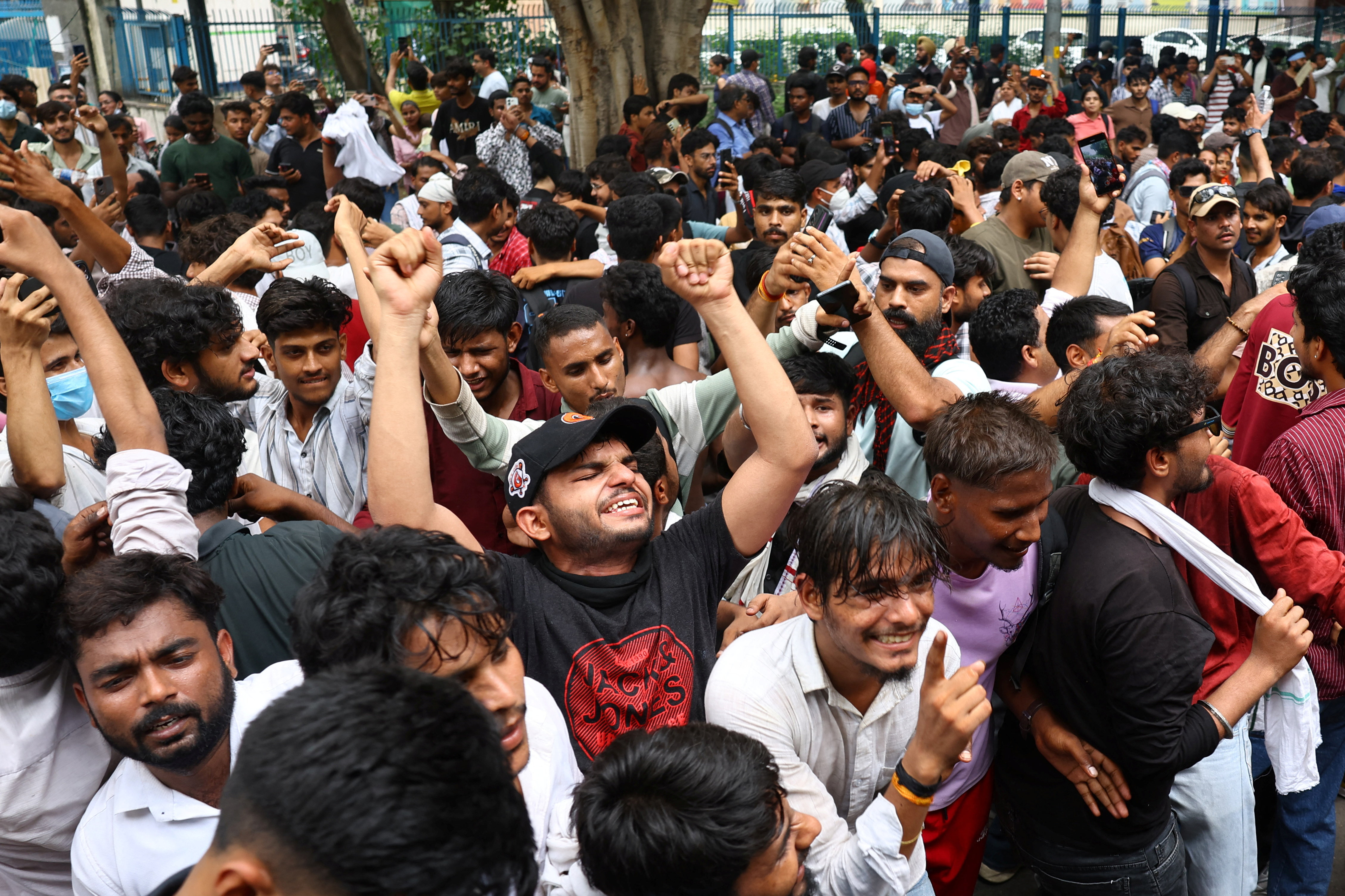 Supporters of India's Cockroach Janta Party (CJP) celebrate after India’s Education Minister Dharmendra Pradhan resigned following days of protests demanding his resignation over National Eligibility cum Entrance Test (NEET) examination paper leaks, at Jantar Mantar in New Delhi, July 25, 2026. REUTERS/Anushree Fadnavis