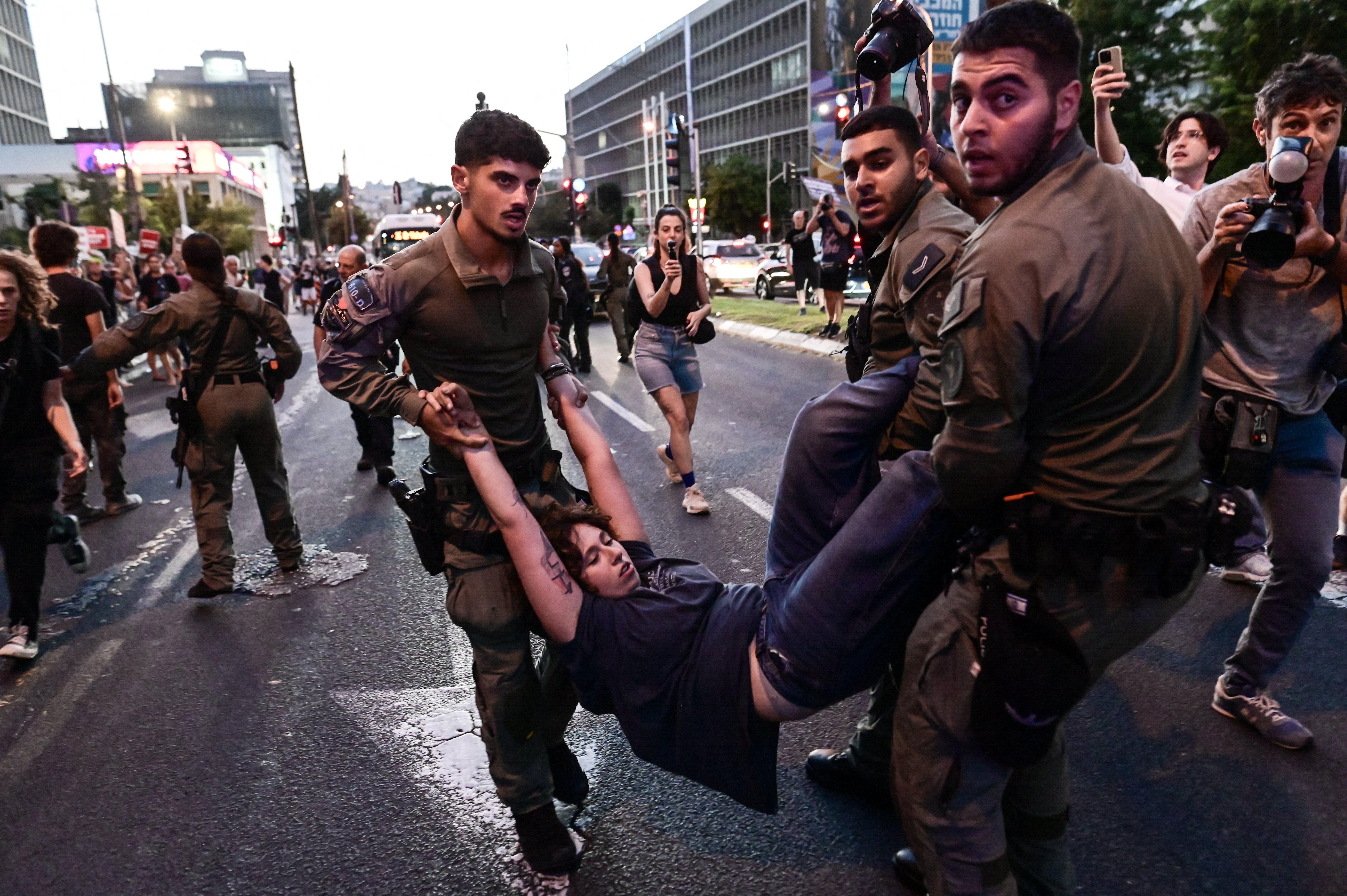 Israeli security personnel detain a protester during a demonstration against Israeli settlers' violence in the occupied West Bank, in Tel Aviv, Israel, July 25, 2026.