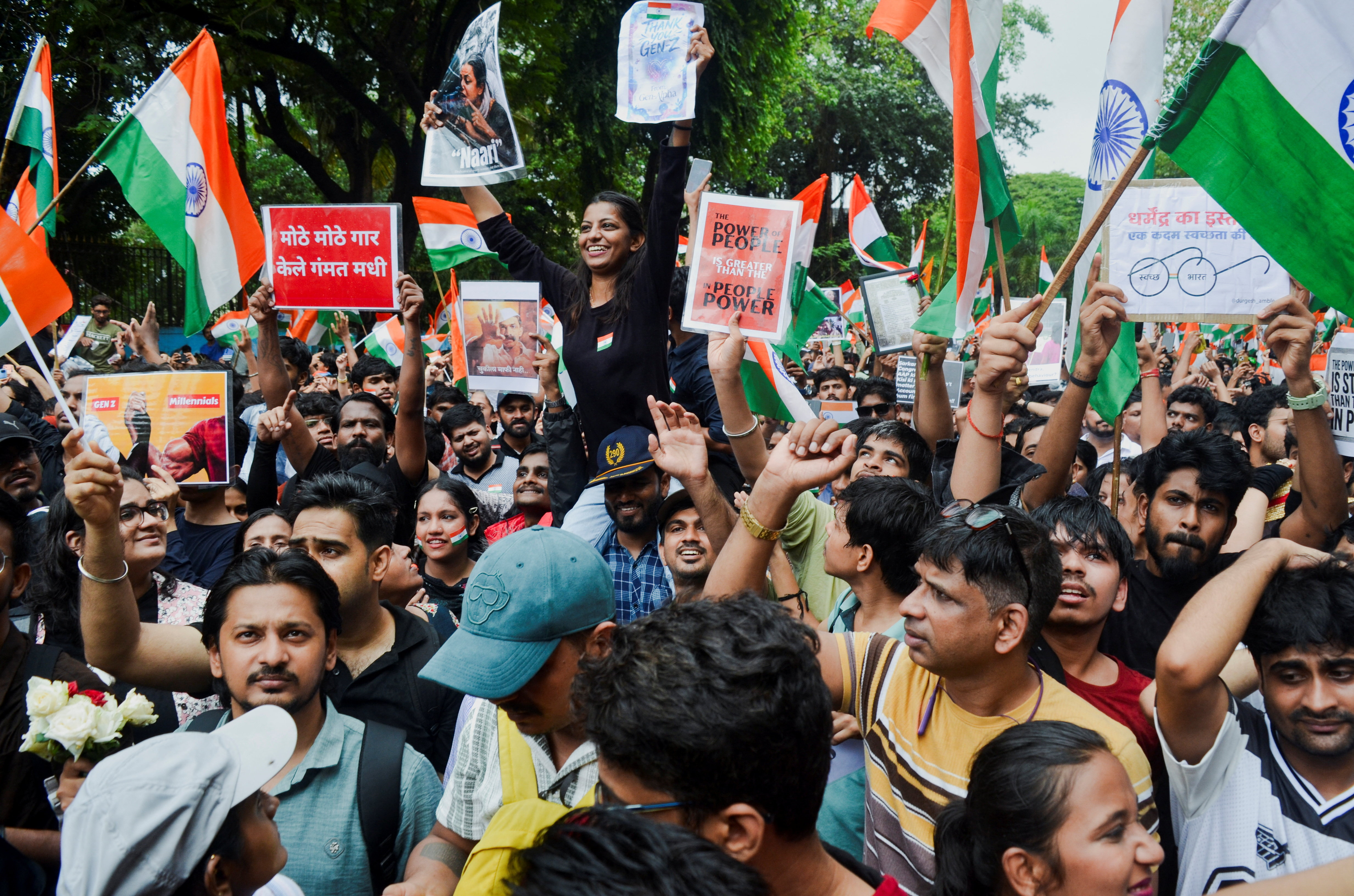 Cockroach Janta Party (CJP) supporters chant slogans, hold placards and wave national flag as they celebrate the resignation of Education Minister Dharmendra Pradhan over the National Eligibility cum Entrance Test (NEET) examination paper leaks, following a protest, in Mumbai, India on July 26, 2026. [Indranil Aditya/Reuters]