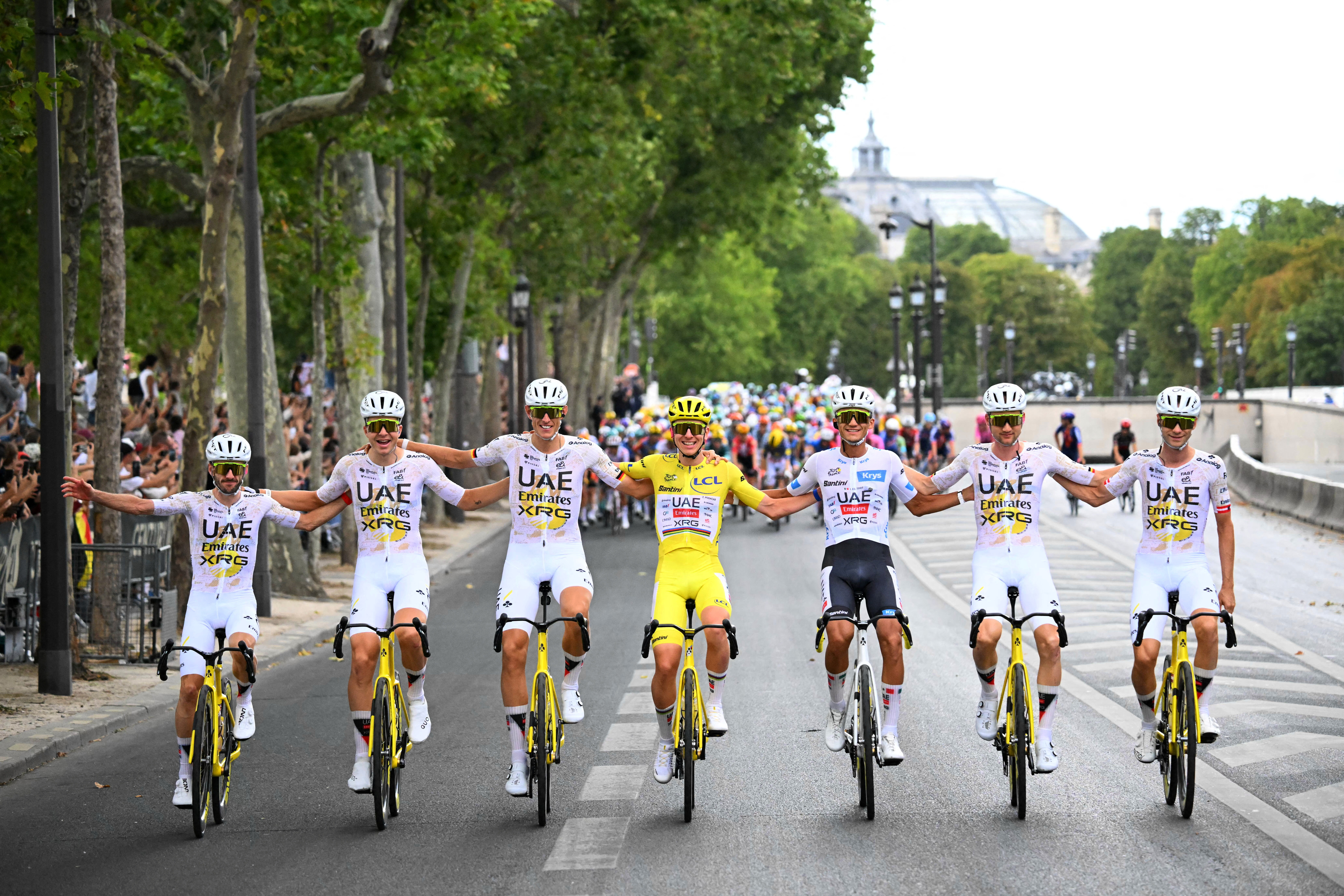 Cycling - Tour de France - Stage 21 - Paris, France - July 26, 2026 UAE Team Emirates XRG's Tadej Pogacar wearing the yellow jersey and UAE Team Emirates XRG's Isaac Del Toro wearing the white jersey celebrate with their teammates after stage 21 Pool via REUTERS/Garnier Etienne TPX IMAGES OF THE DAY