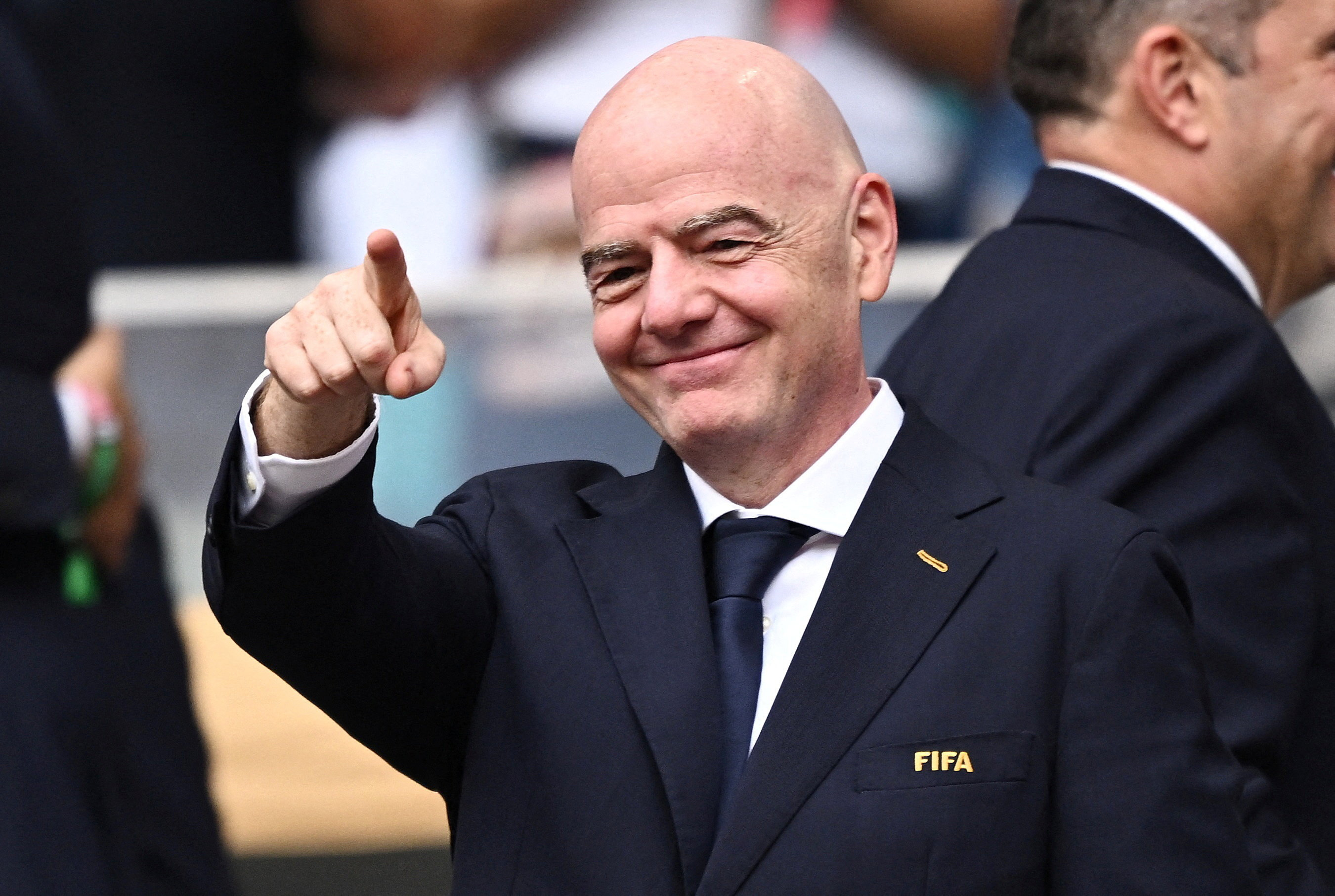 FIFA President Gianni Infantino smiles and gestures.