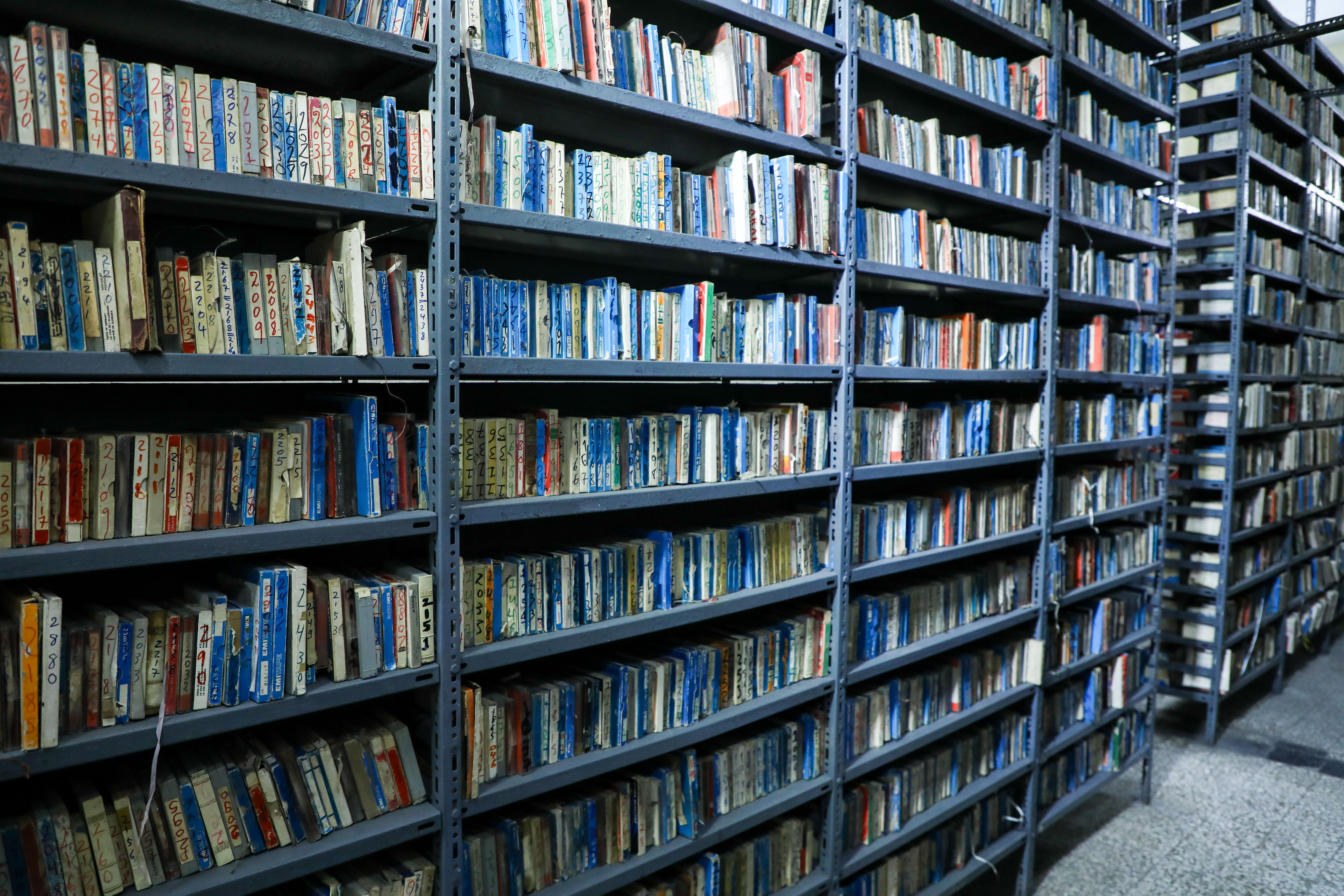 Thousands of tapes fill the shelves of Radio Mogadishu's archive, holding decades of Somali history. [Abdimajid Abdillahi Farah/Al Jazeera]