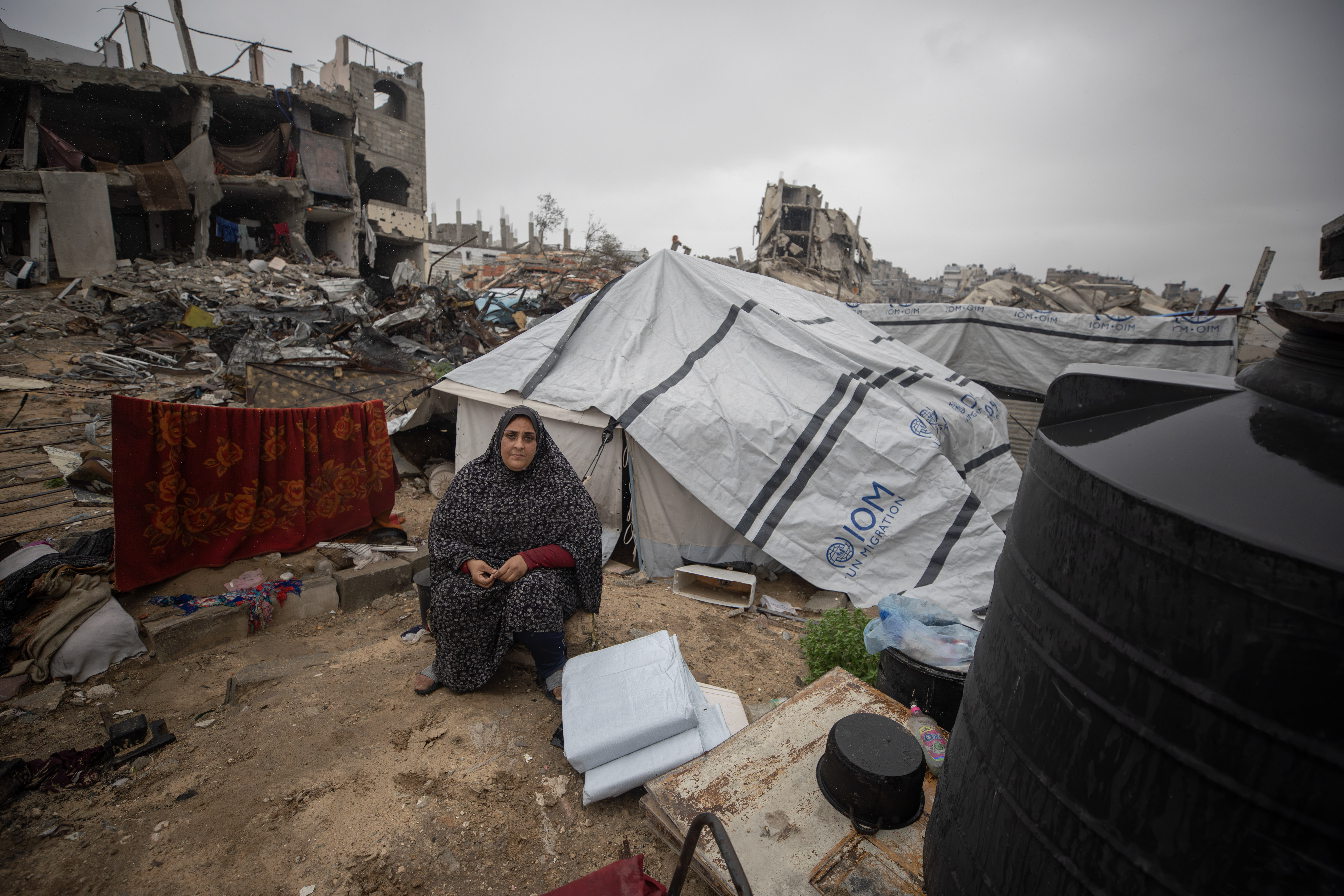 “If I had known our lives would be turned upside down like this, I would have held on to every moment we had,” says Suhail al-Yazji. From Gaza City’s Yarmouk neighbourhood, Suhail now supports her family alone after her husband was injured during the war. She lives in a damaged tent reinforced with tarps beside the rubble of her home. She is pictured here waiting for her children to return from an informal education class held at a nearby displacement site.