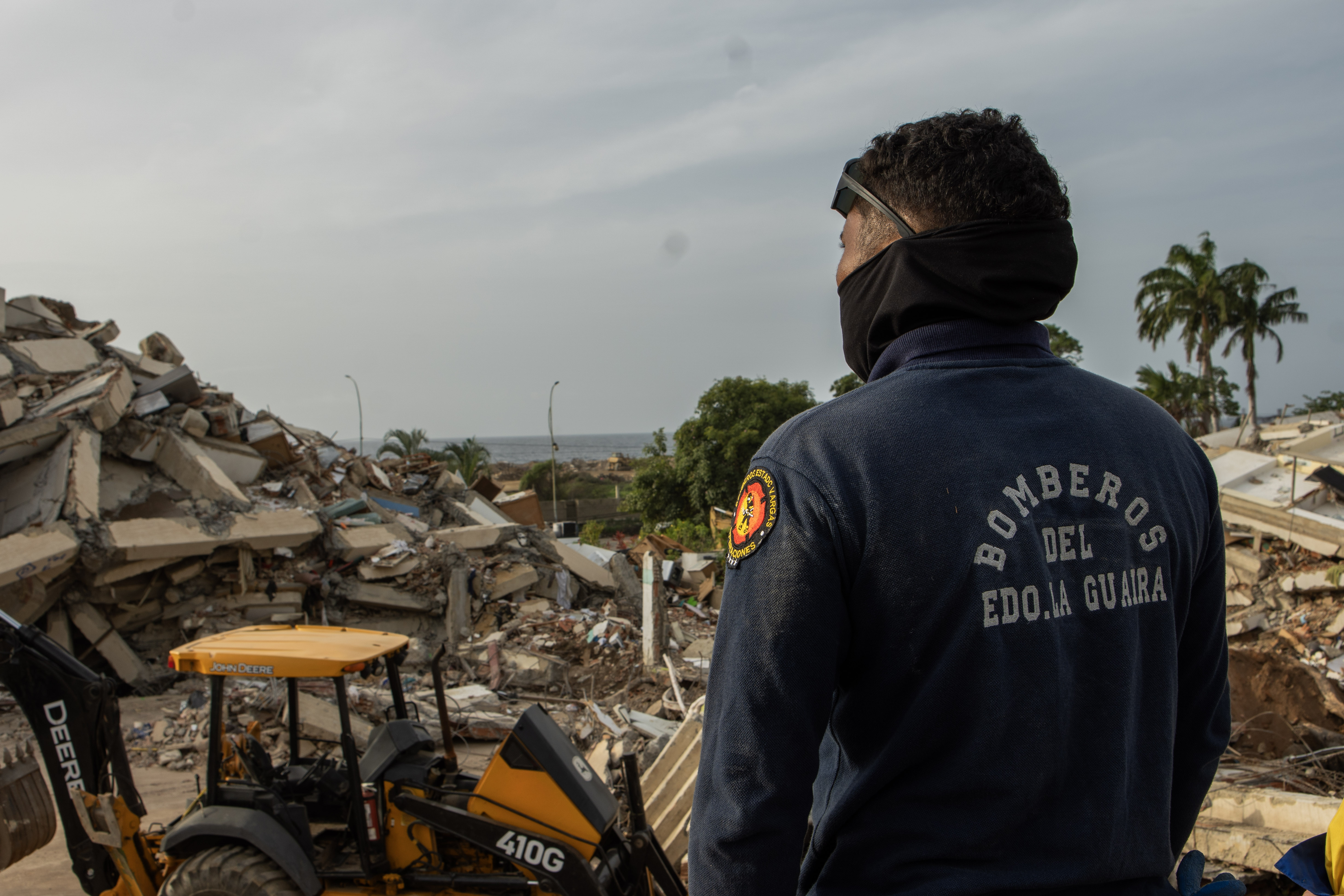 Jesus Garcia looks at the remains of the Ritasol Palace apartment complex [Alfie Pannell]