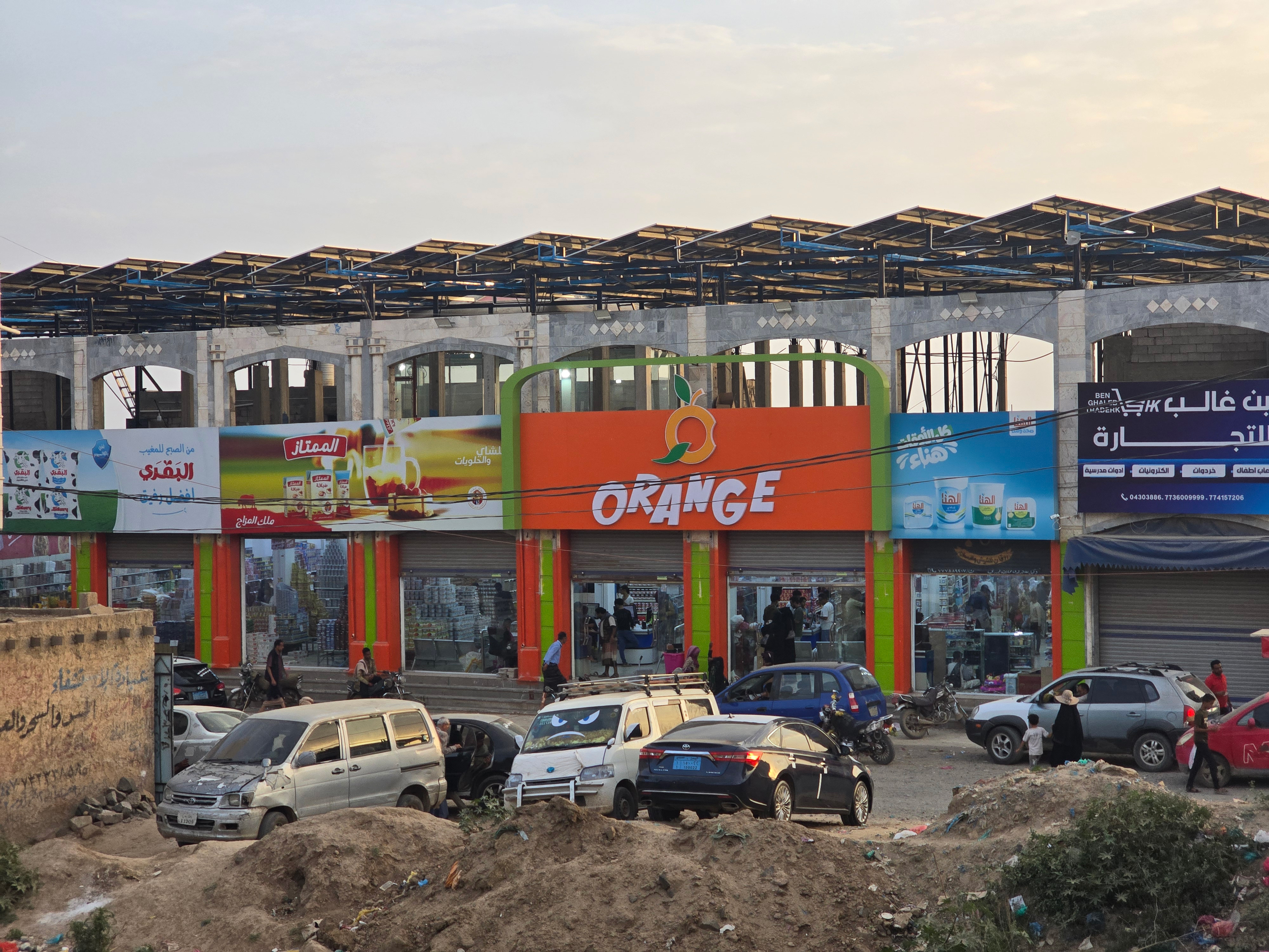 Solar panels cover the roof of a mall in Taiz, providing a clean alternative to private generators