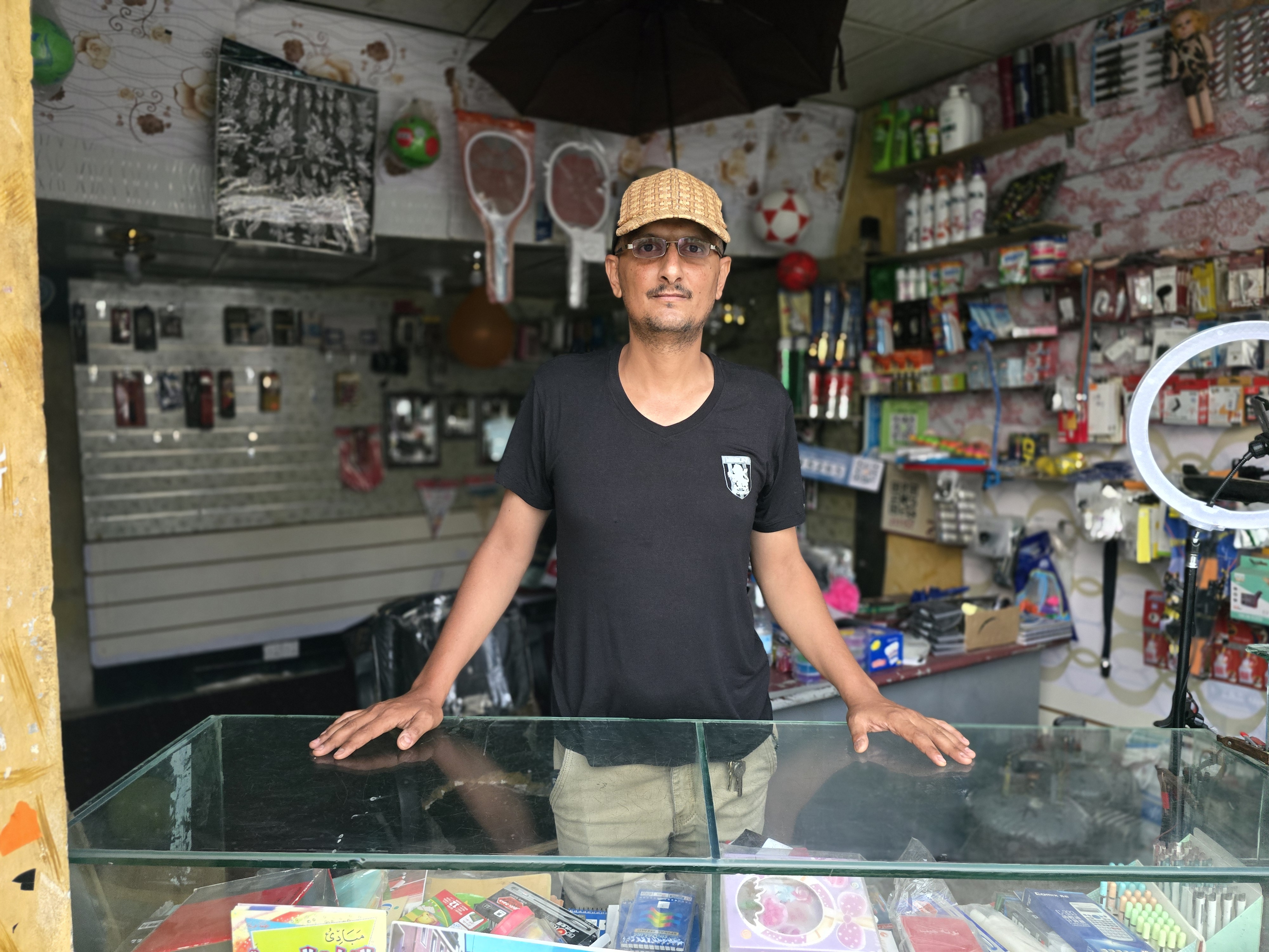Tareq Al-Mallah, a shop owner in Taiz, has noticed a rise in women-led businesses that are actively competing with men in the local market. [Nasser Al-Sakkaf/Al Jazeera]